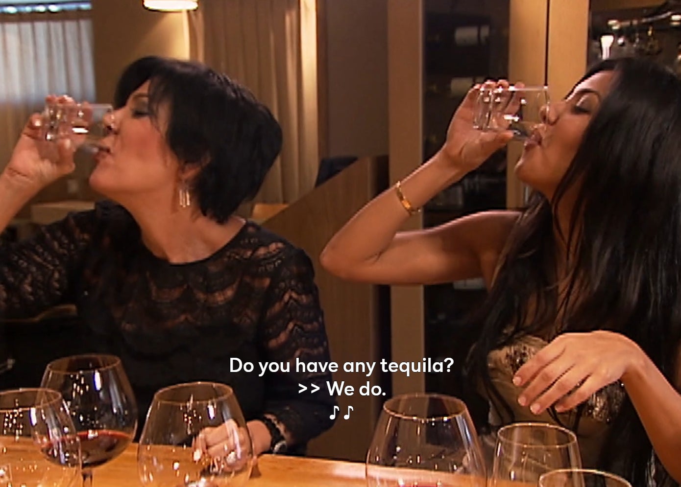 Kris Jenner and Kourtney Kardashian doing a shot of tequila