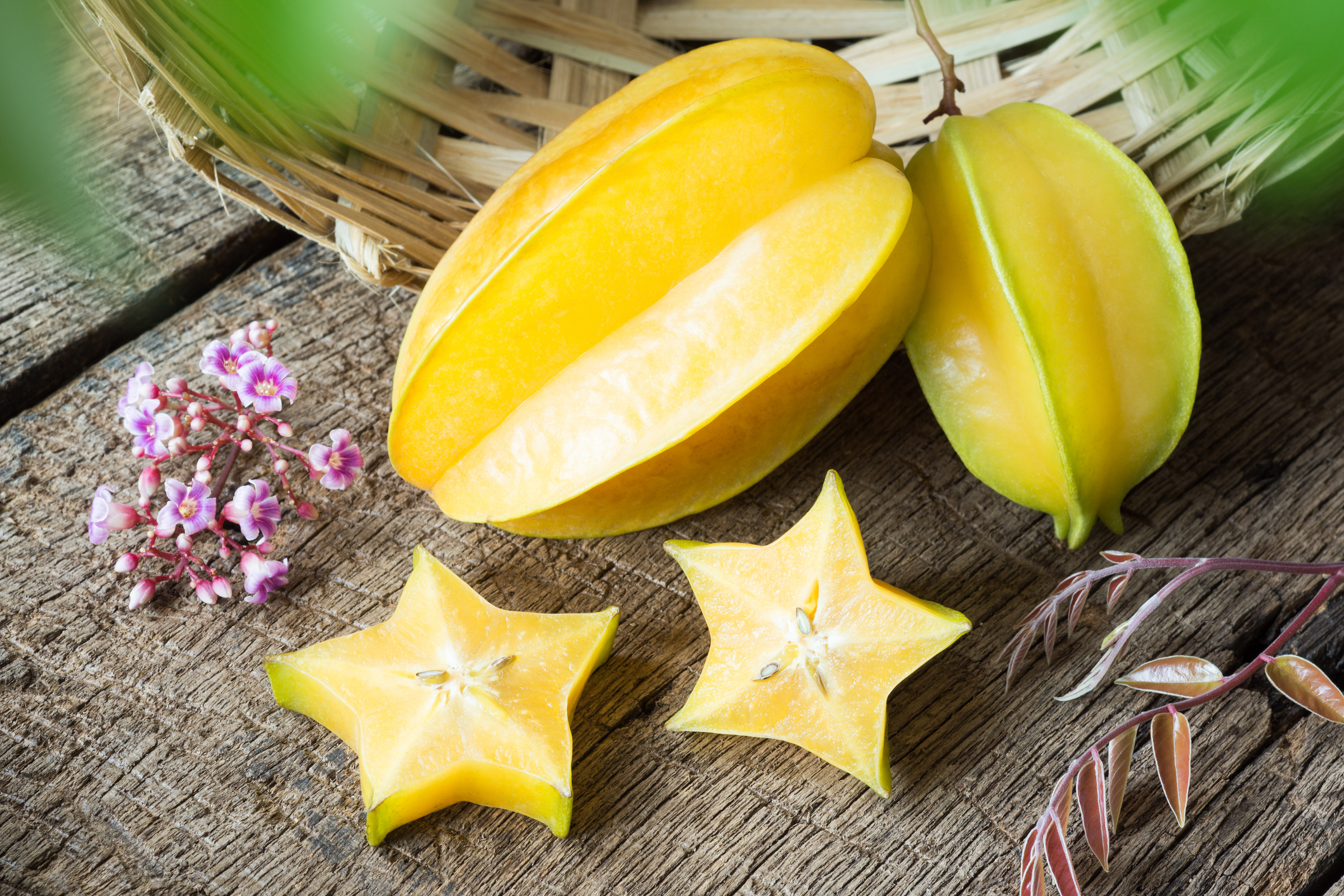 Close-up of cut and whole star fruit
