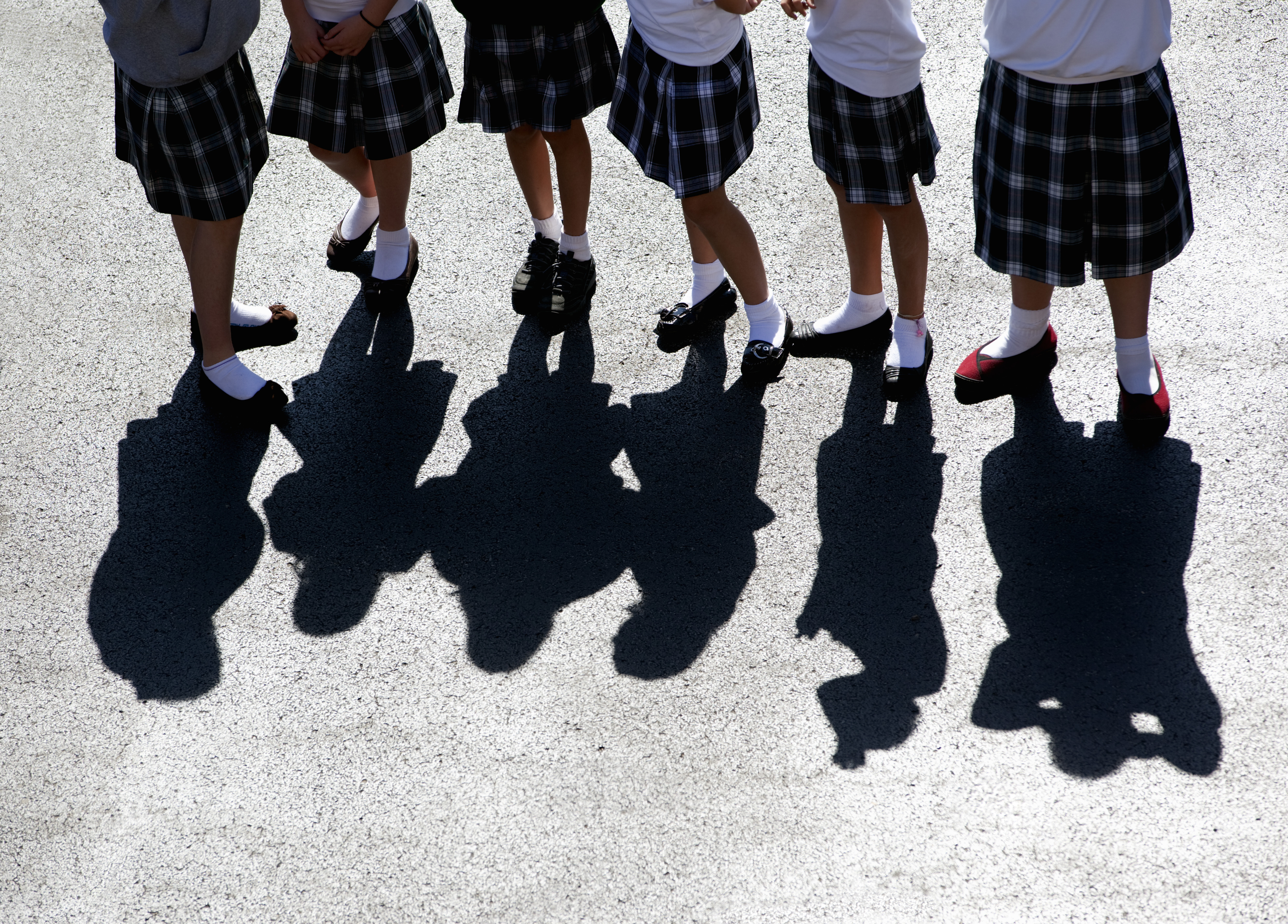 Girls wearing parochial school uniforms