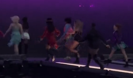 Taylor and her backup dances running onstage