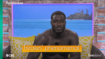 Love Island contestant smiling and saying freakin phenomenal