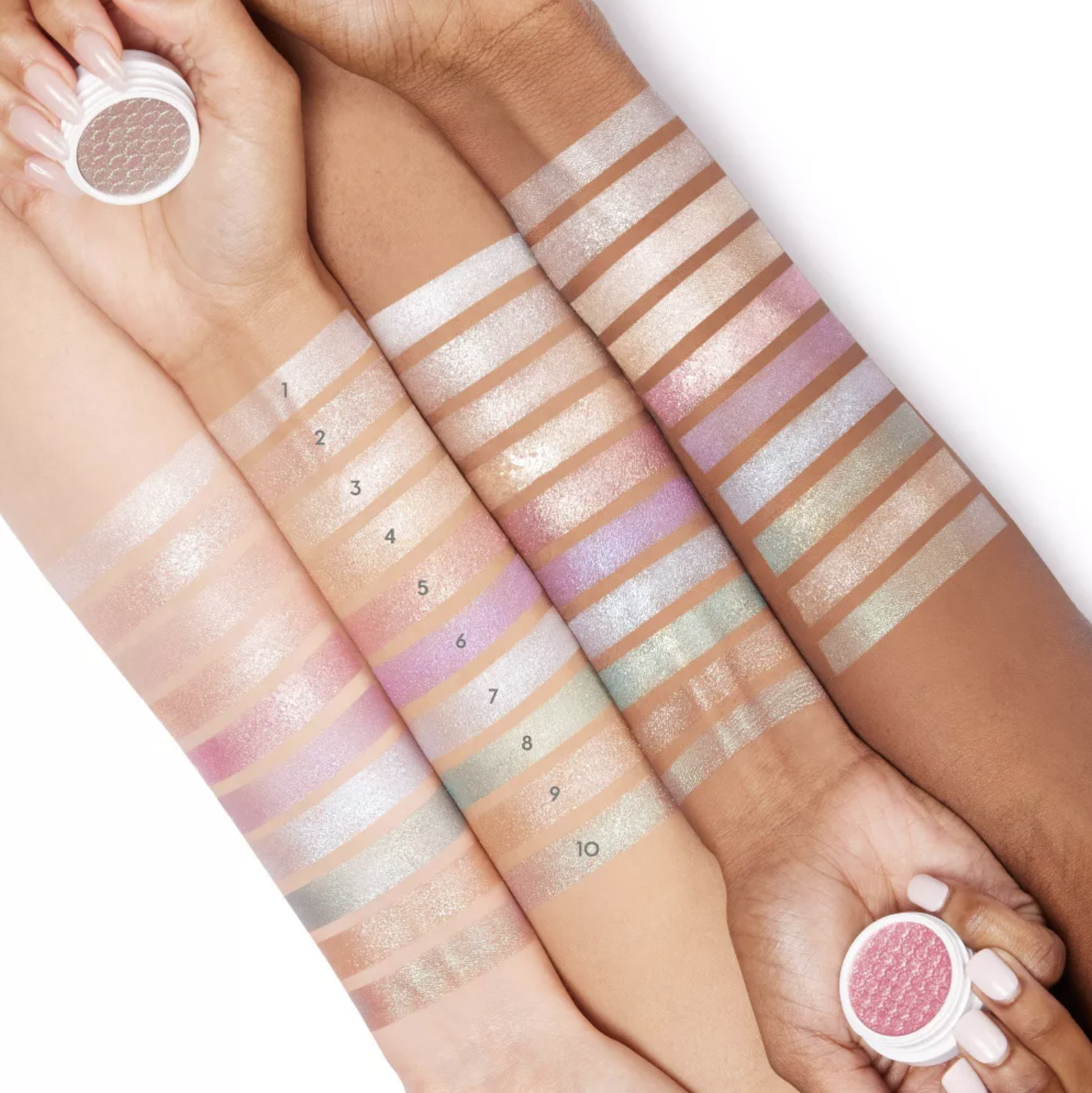 Four models of different skin tones with each color swatched on their arms