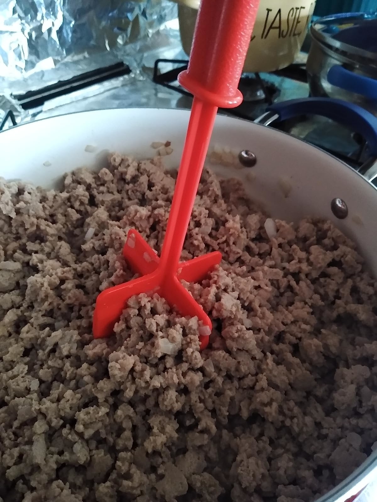 Reviewer&#x27;s photo of the meat masher in use