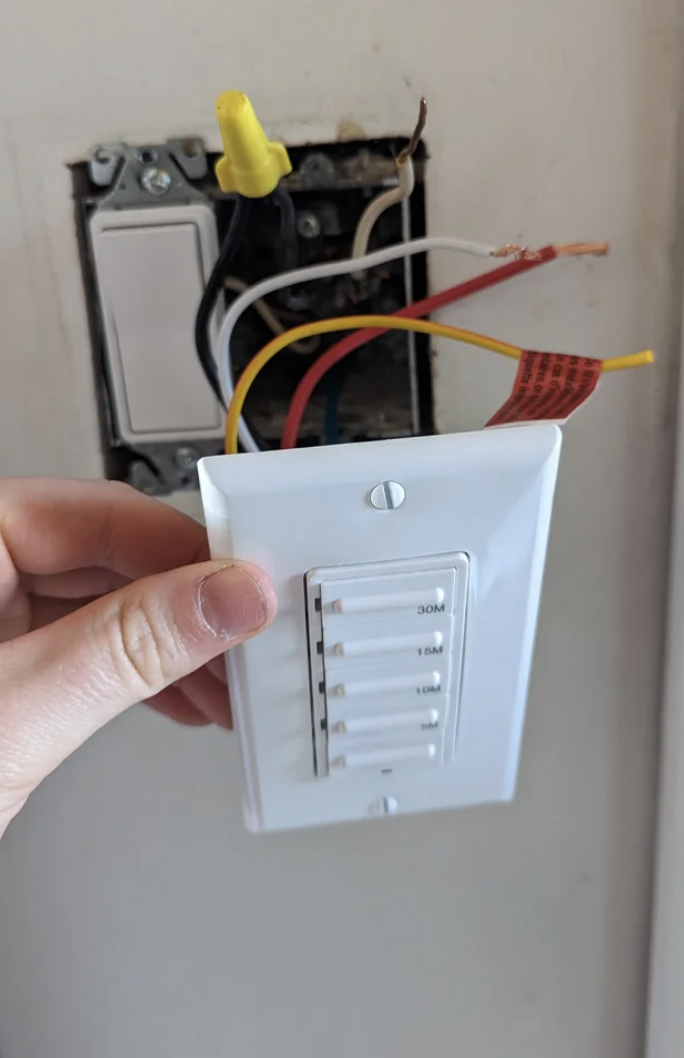 A timer switch being installed in a room