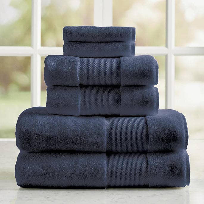 a stack of luxury navy blue towels