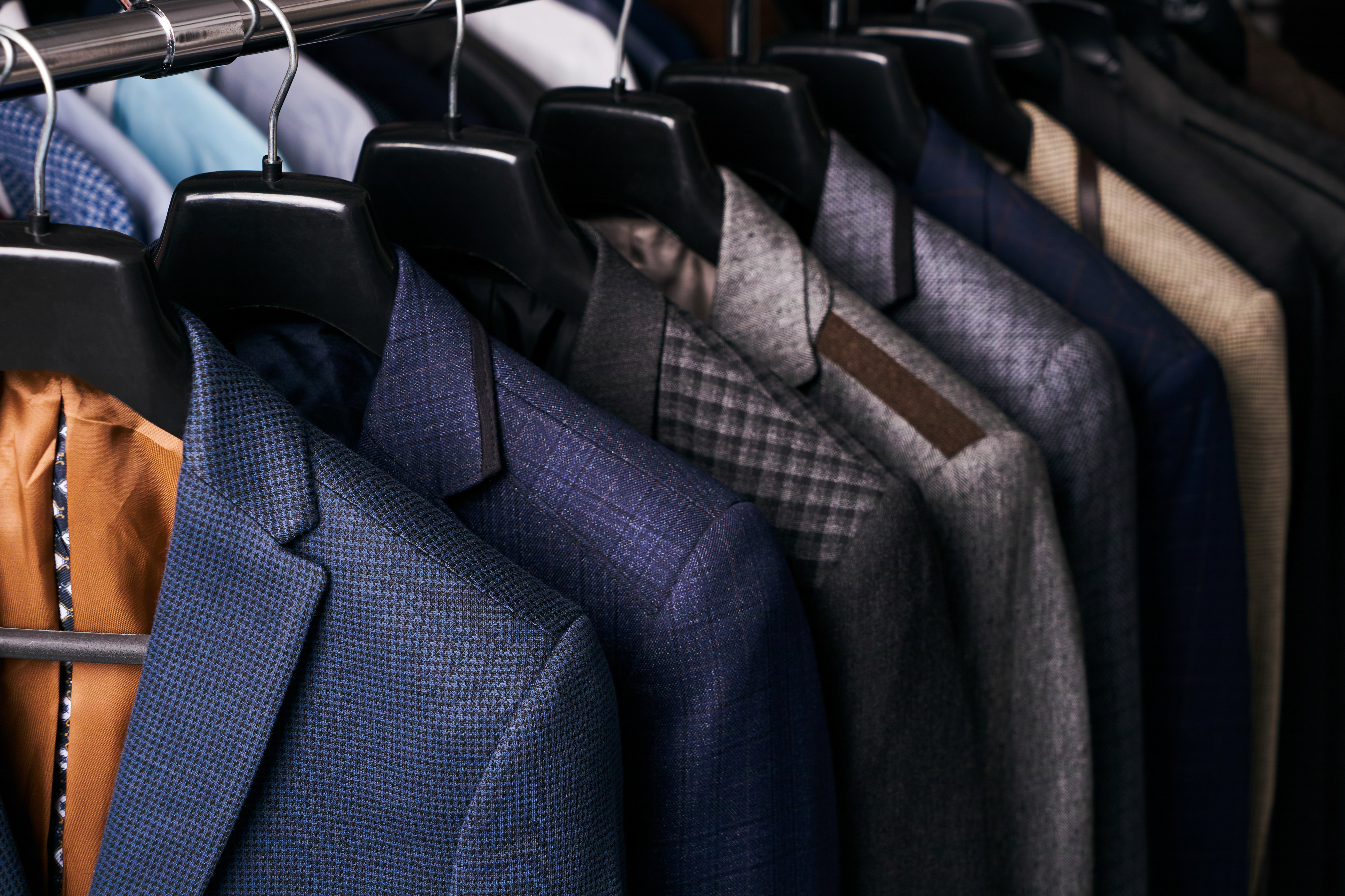 expensive suits on a rack