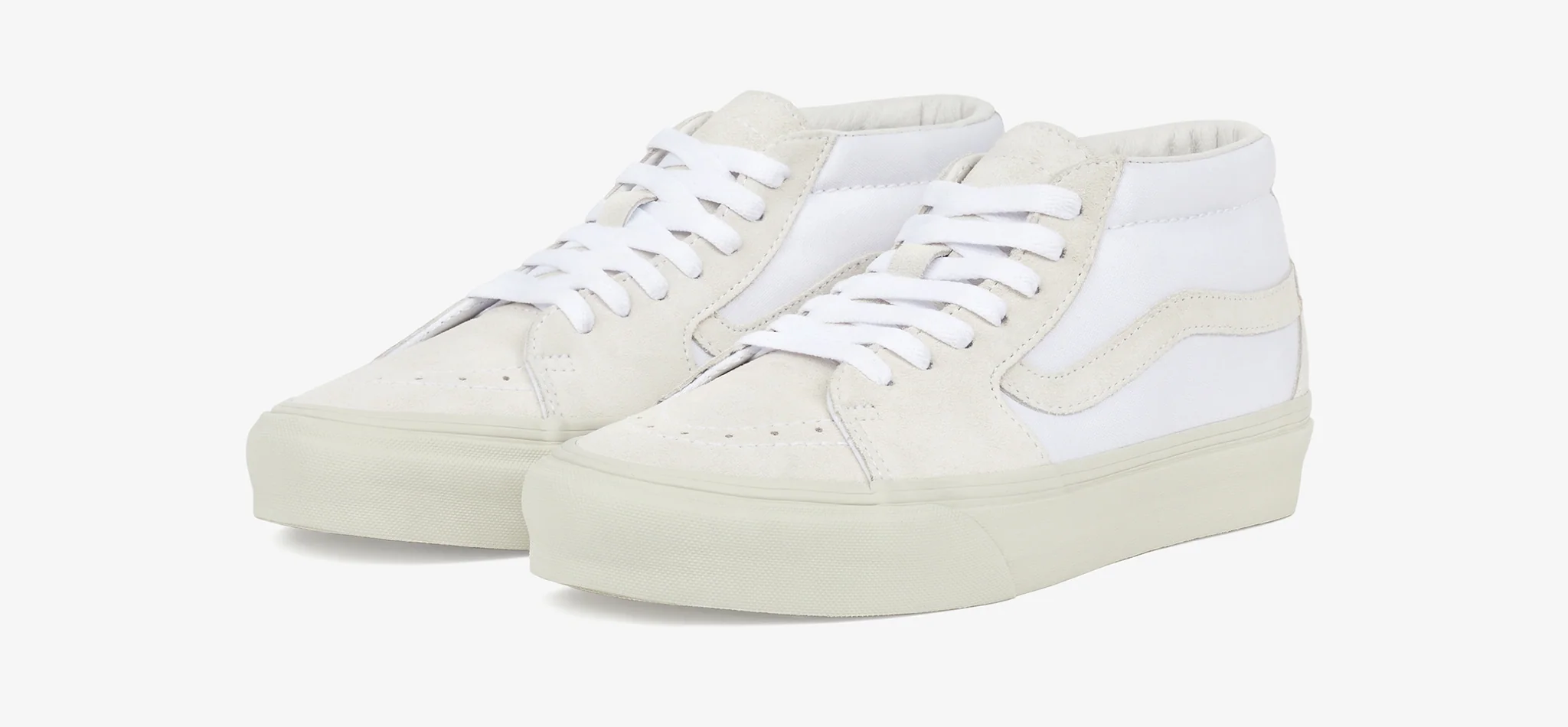 A clean product shot of JJJJound Sk8-Mid VLT LX Sneakers.