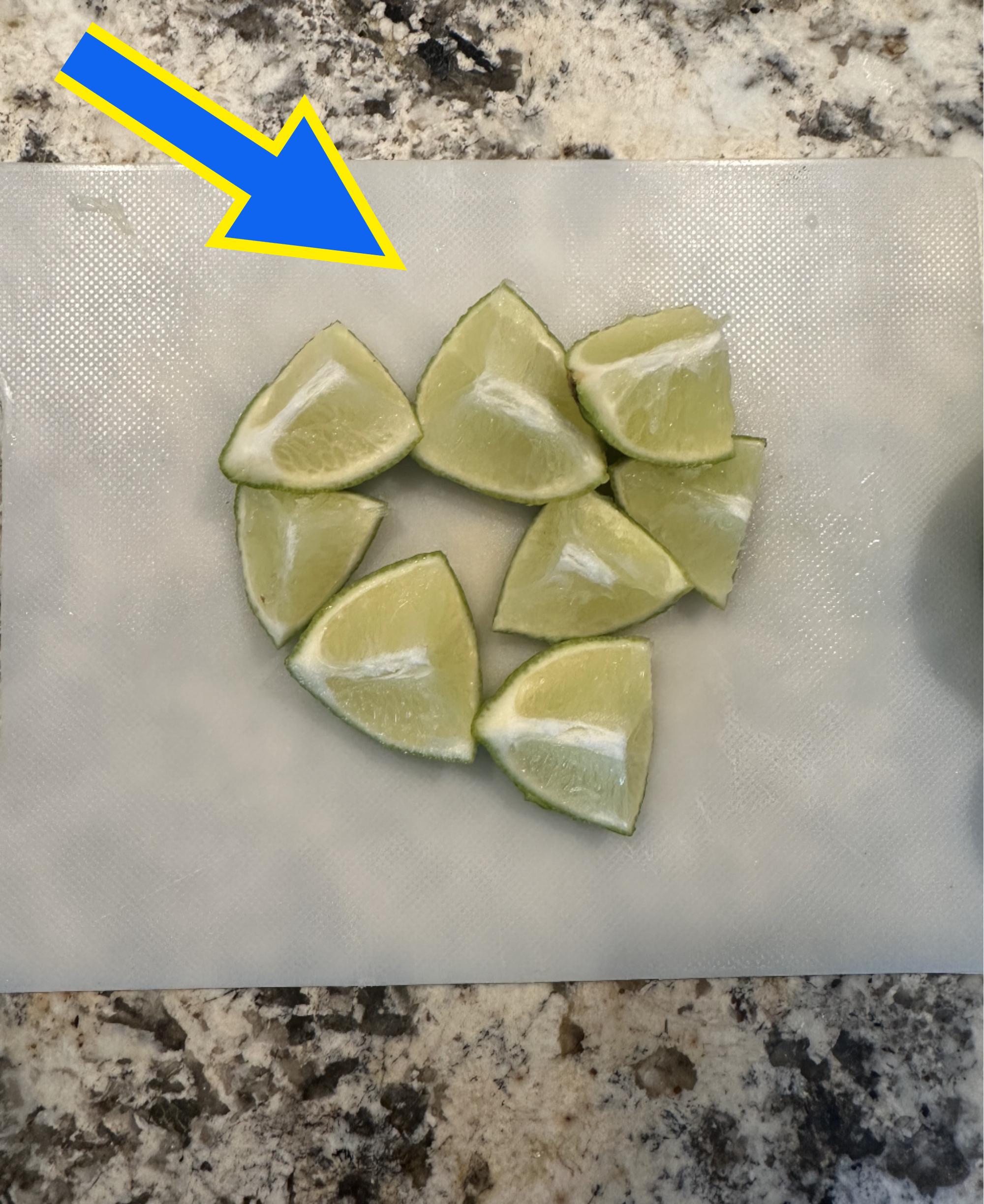 lime wedges on a cutting board