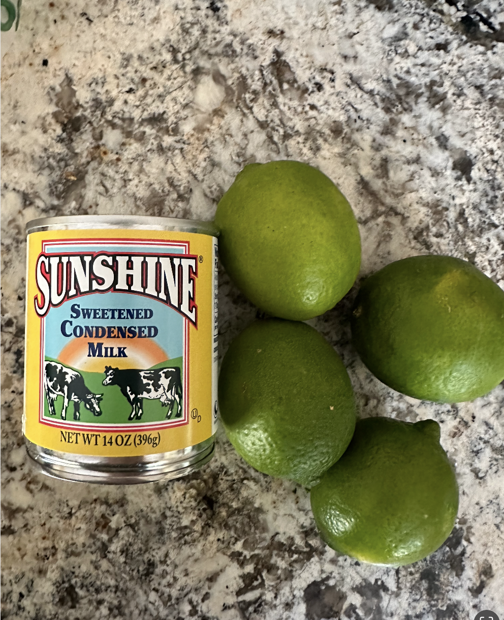 a photo of sweetened condensed milk and limes