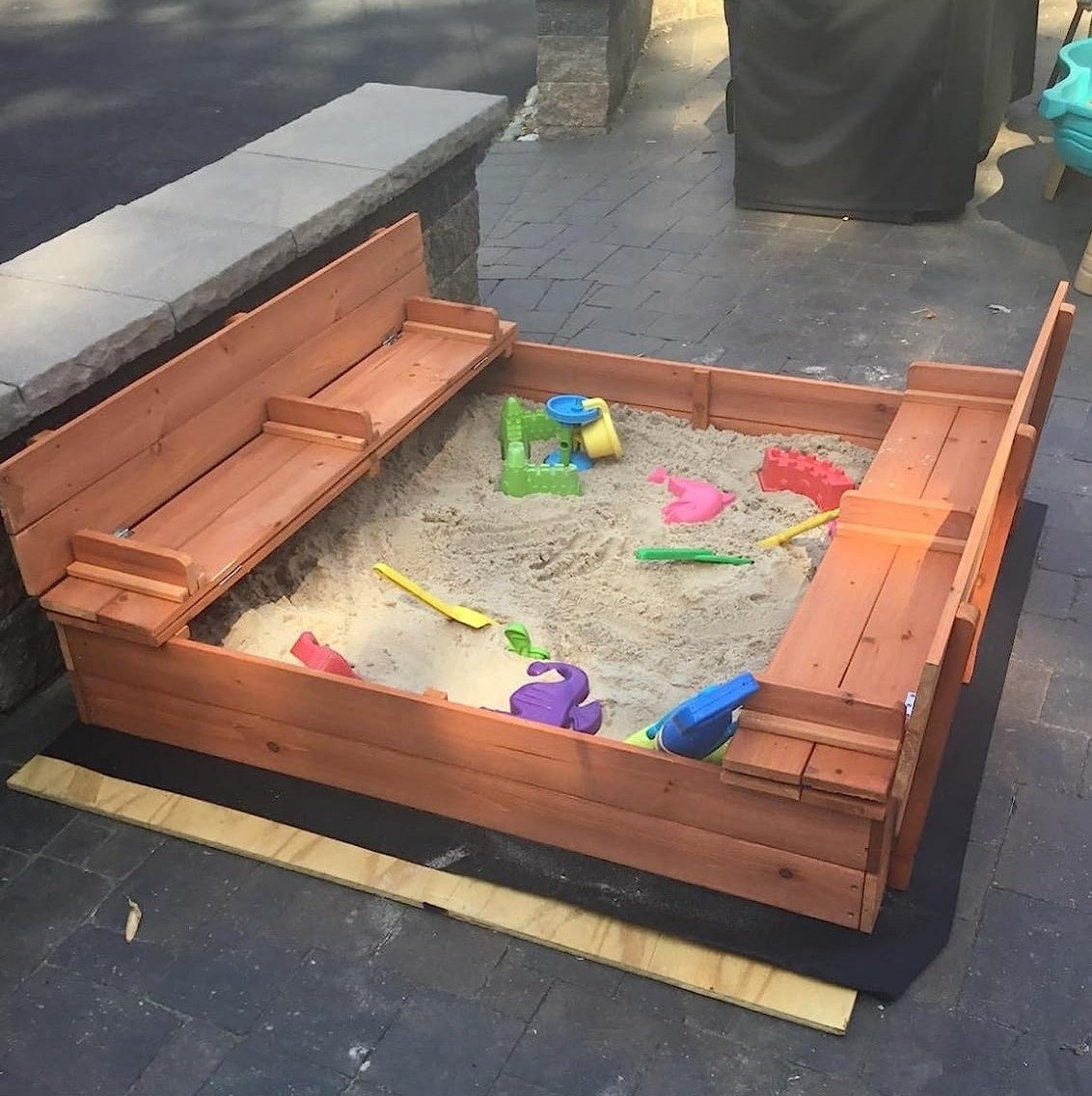 Sandbox with seating on a deck