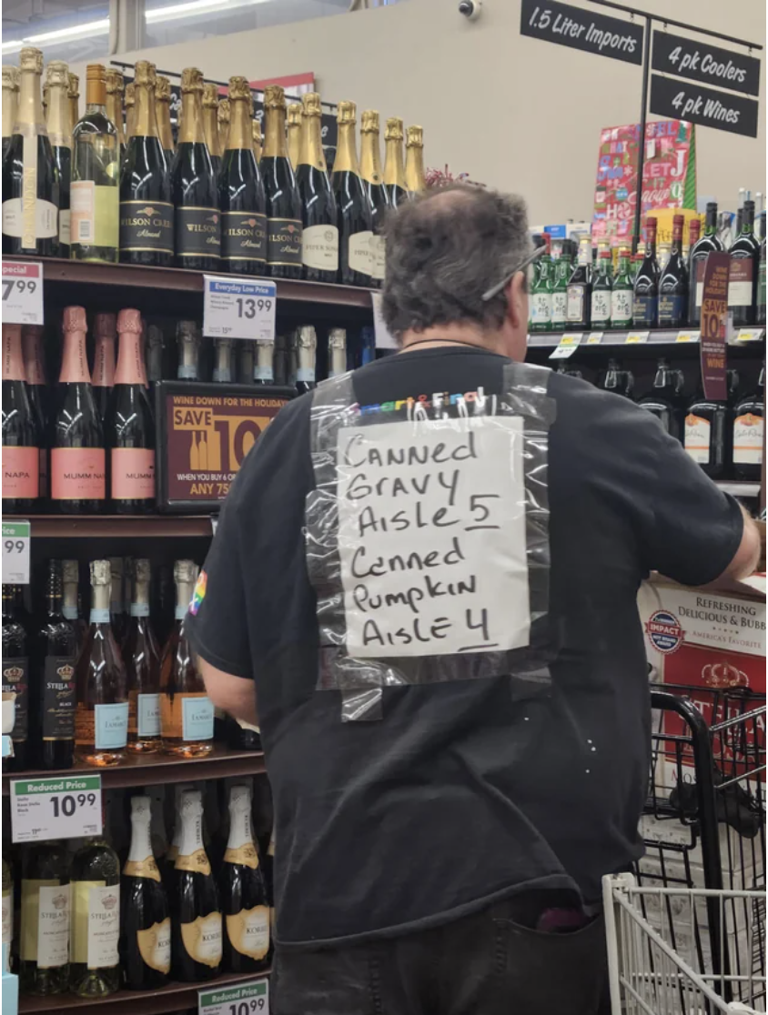 note taped to their back that says, canned gravy aisle 5, canned pumpkin aisle 4