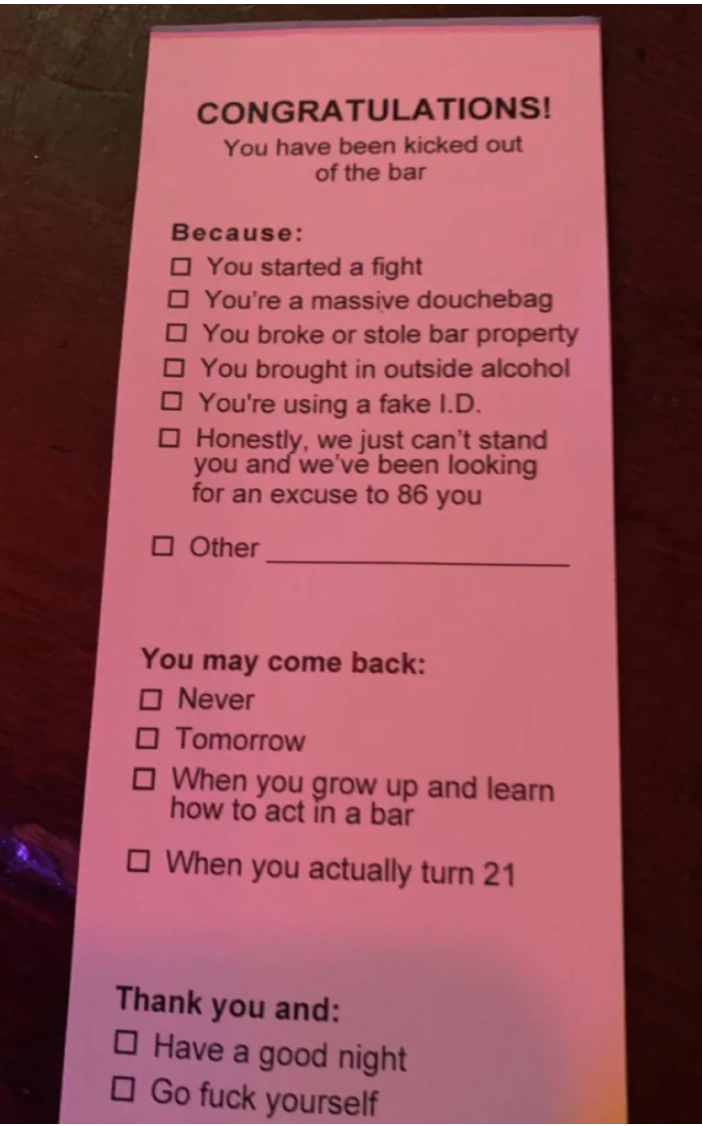 A card explaining why someone got kicked out of a bar