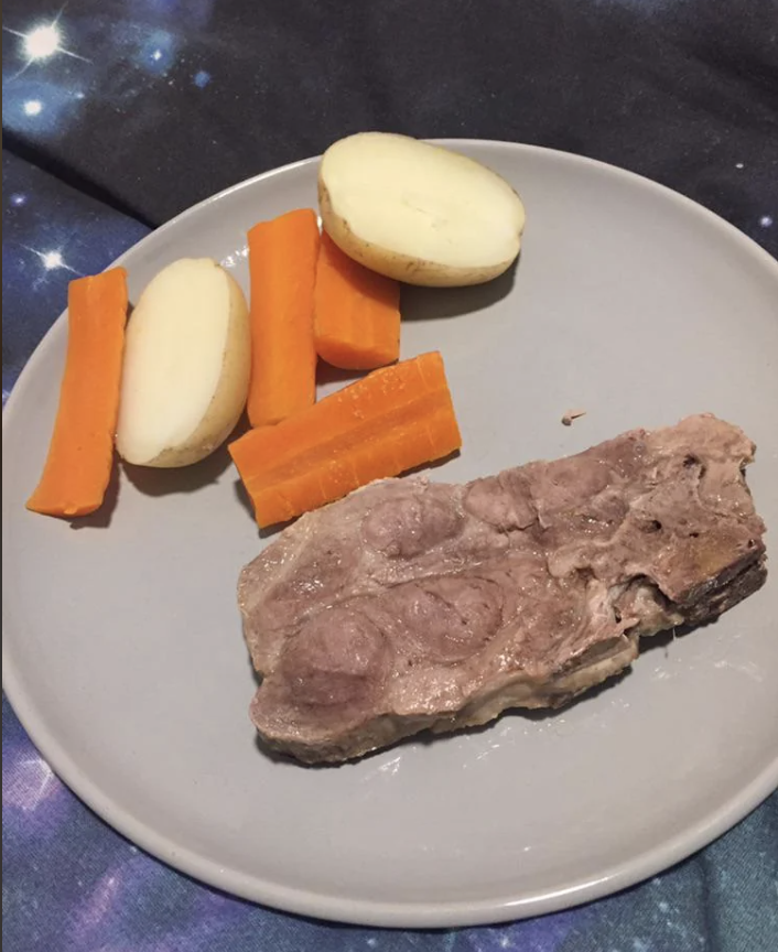 Carrots, potatoes, and a piece of meat on a plate