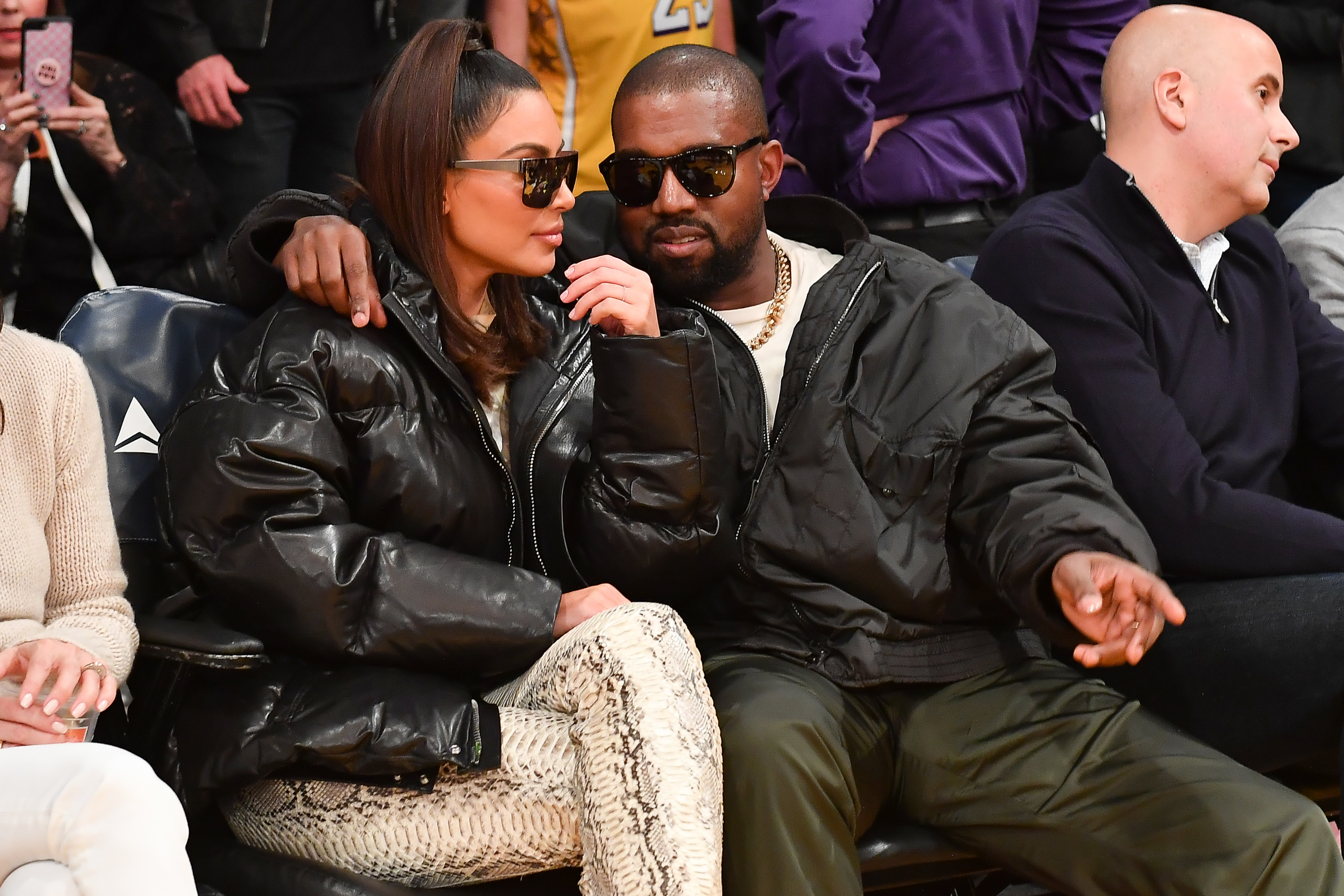 Kim and Ye in the crowd at a sports event