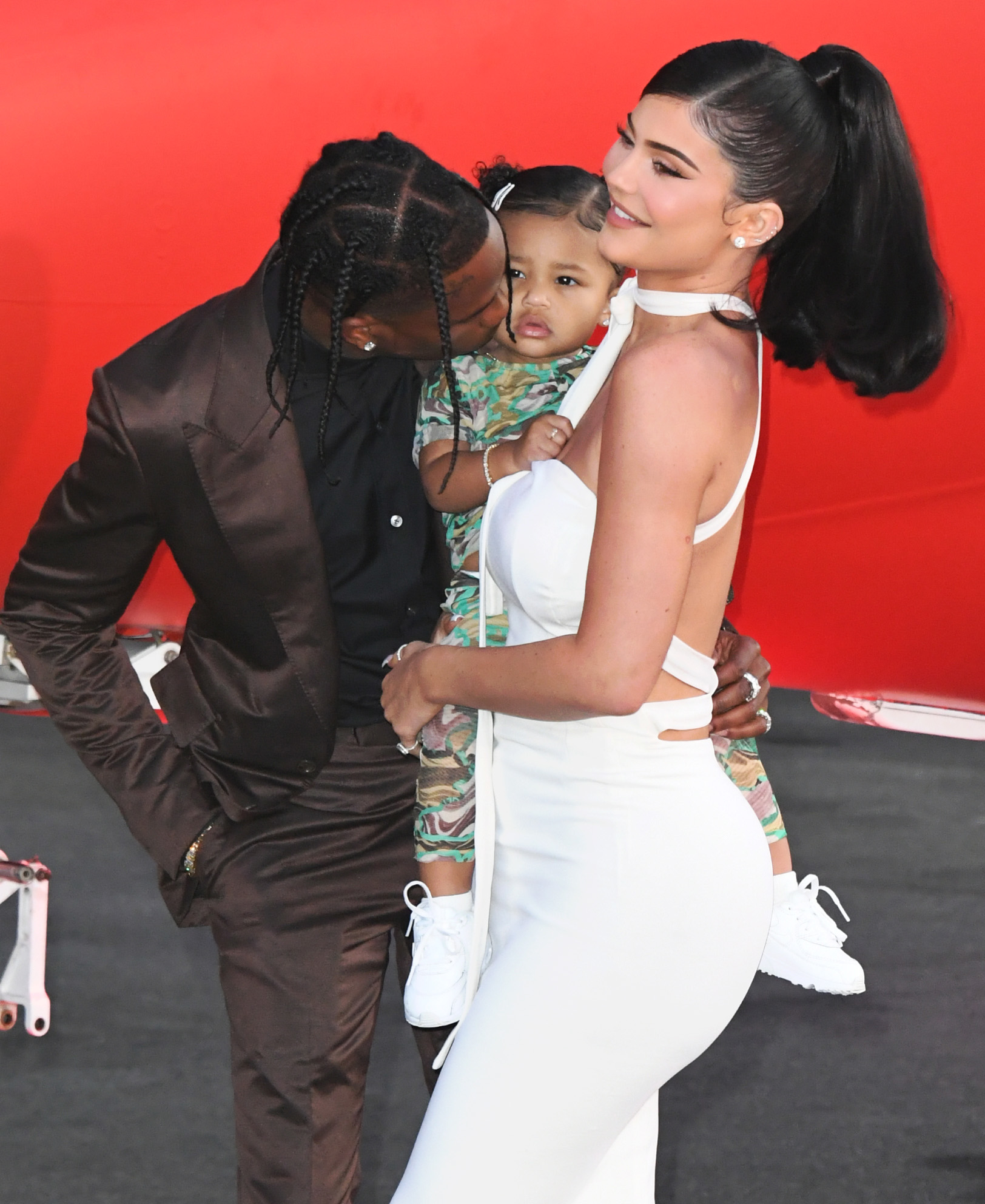 Close-up of Kylie with Stormi and Travis Scott