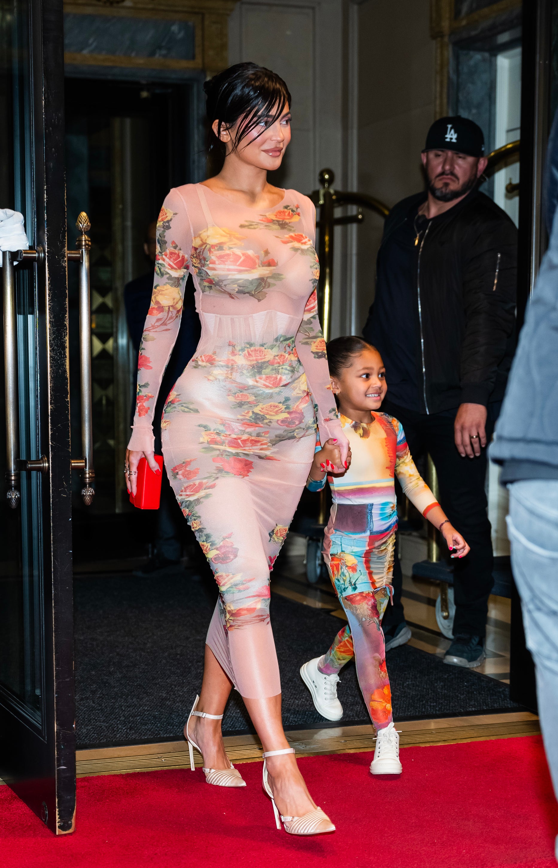 Close-up of Kylie walking with Stormi