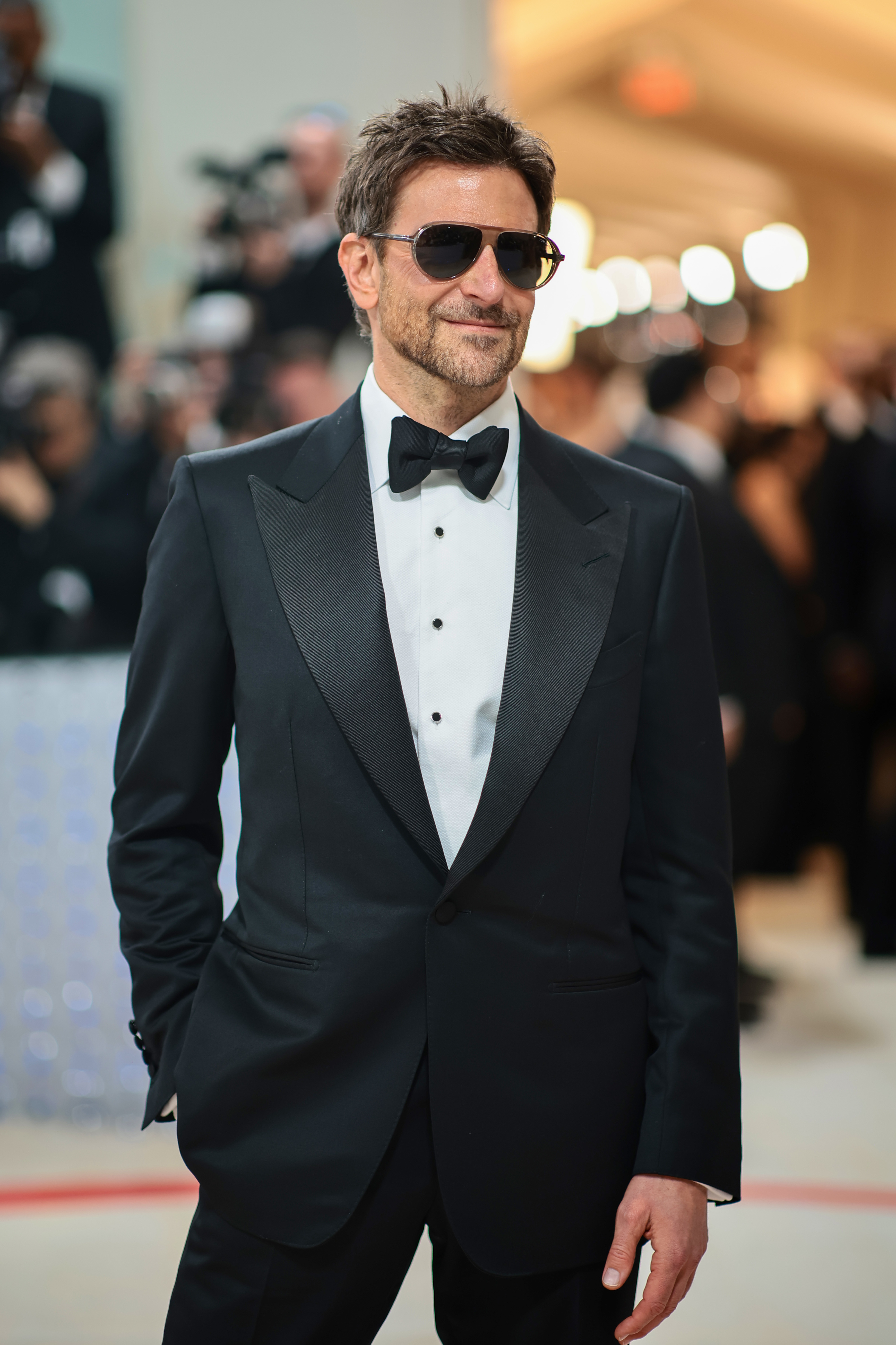him wearing a suit and sunglasses at an event
