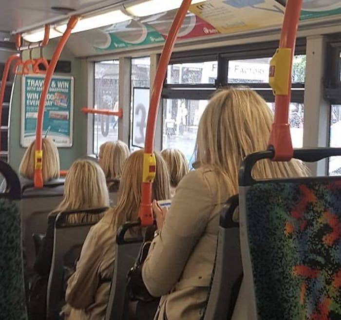 A bunch of blonde women on a bus