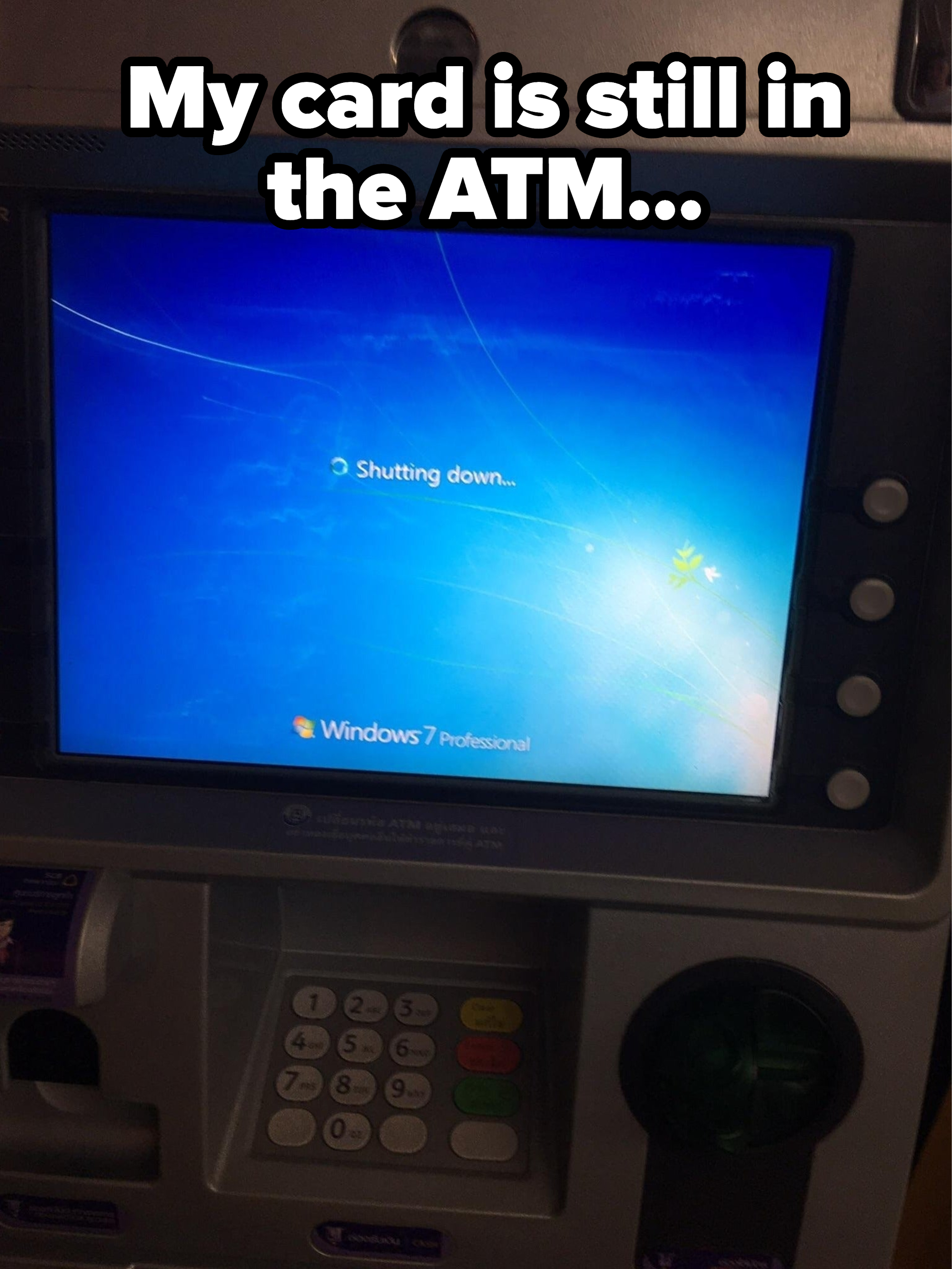 An ATM with a Windows 7 &quot;Shutting down&quot; scream and the caption, &quot;My card is still inside the ATM&quot;