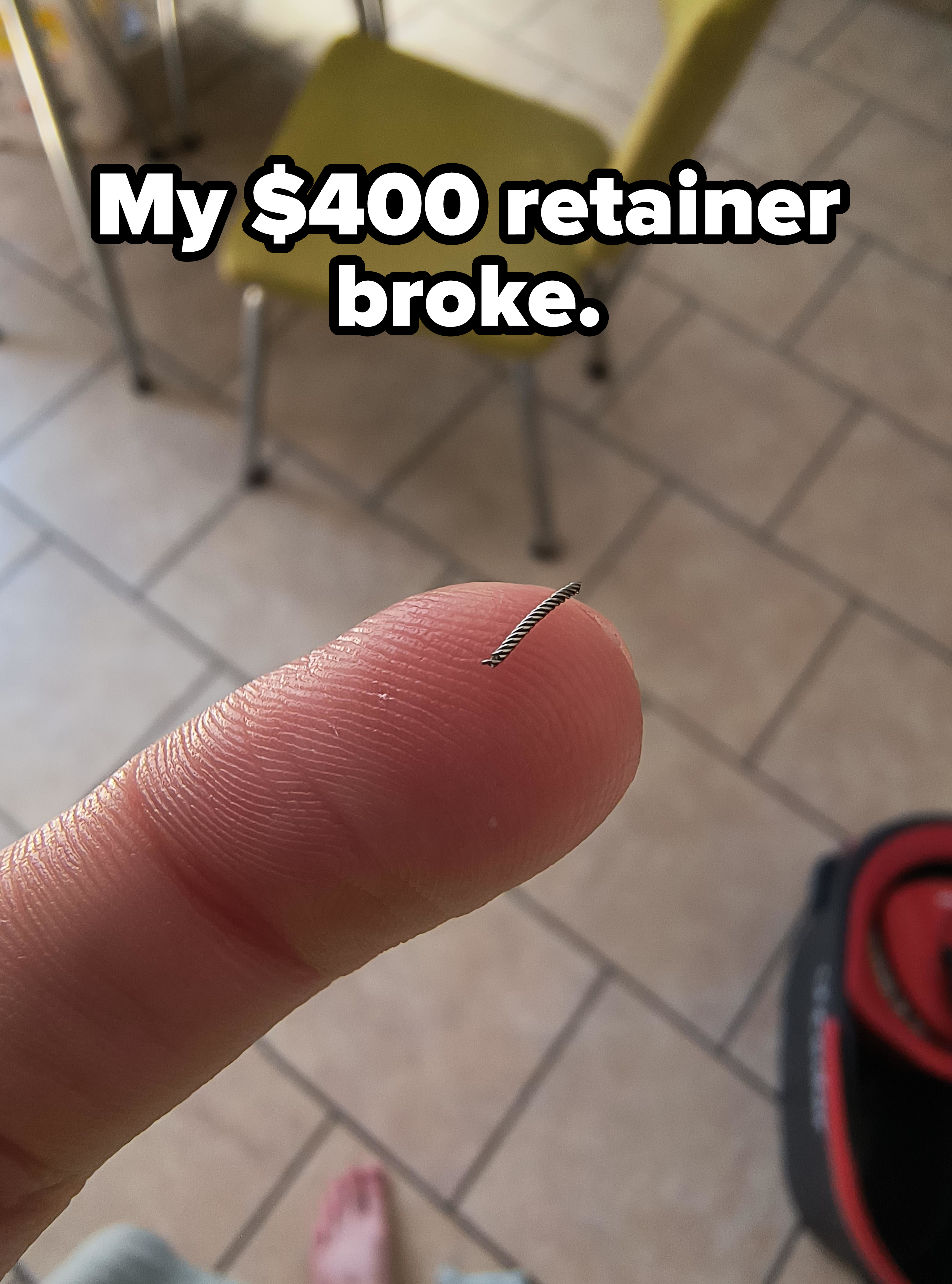 A tiny spring on a finger, with the caption &quot;My $400 retainer broke&quot;