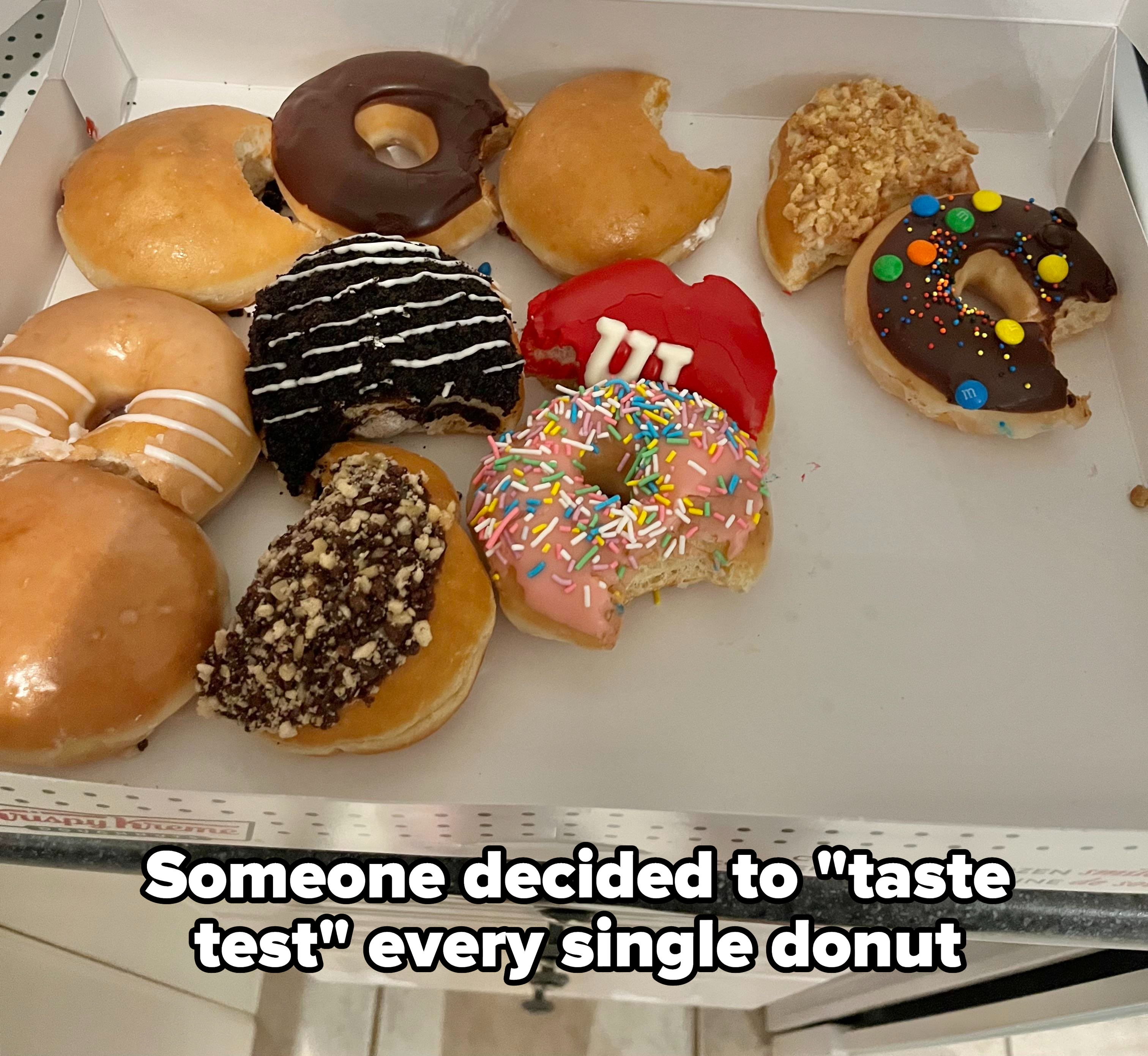 A box of donuts, each with a bite taken out of it, with the caption &quot;Someone decided to &#x27;taste test&#x27; every single donut&quot;