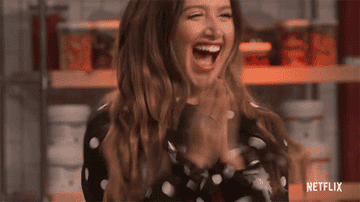Ashley Tisdale jumping up and down clapping