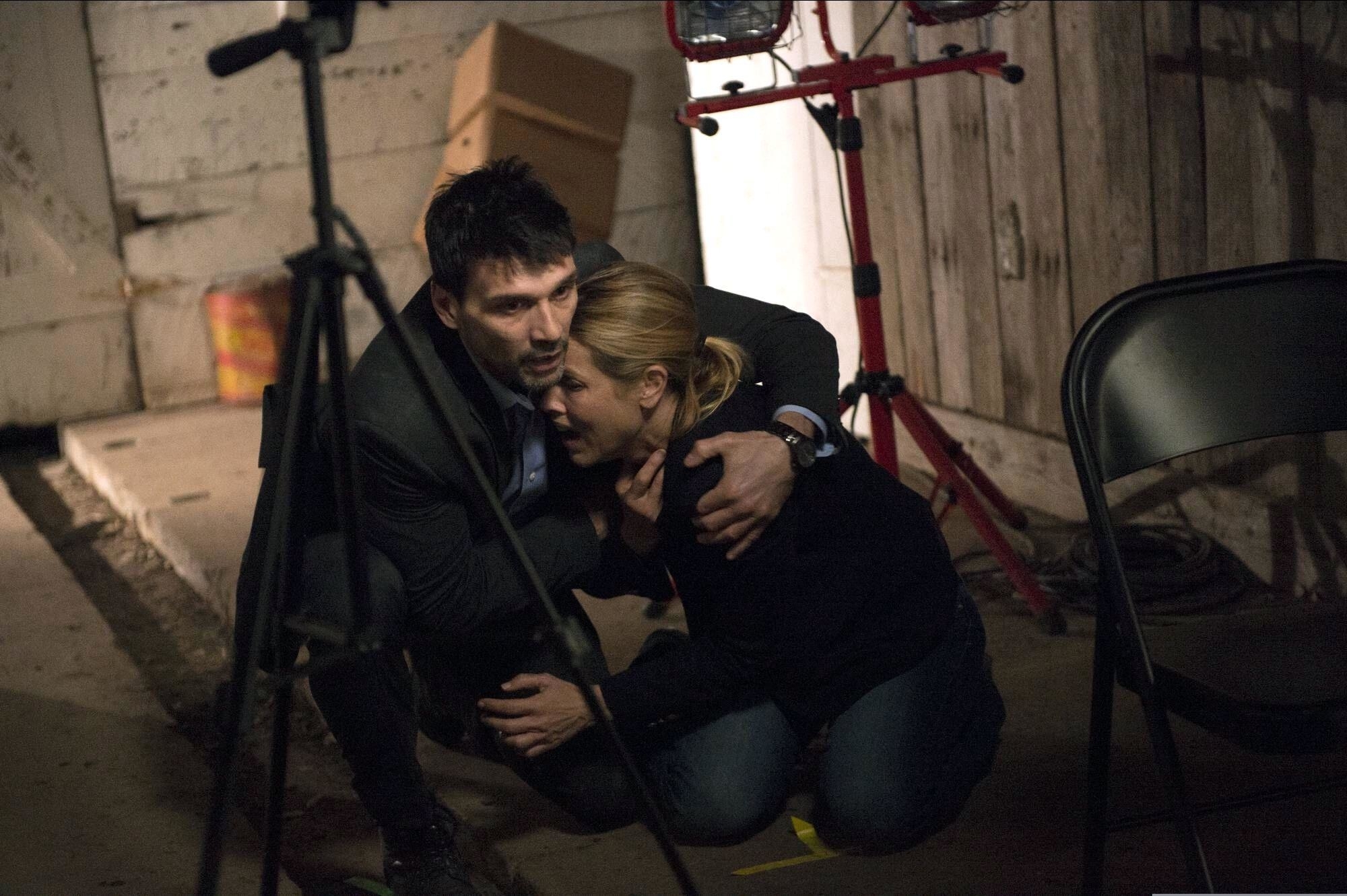 Frank Grillo wraps himself around a screaming Maria Bello in a decrepit shed