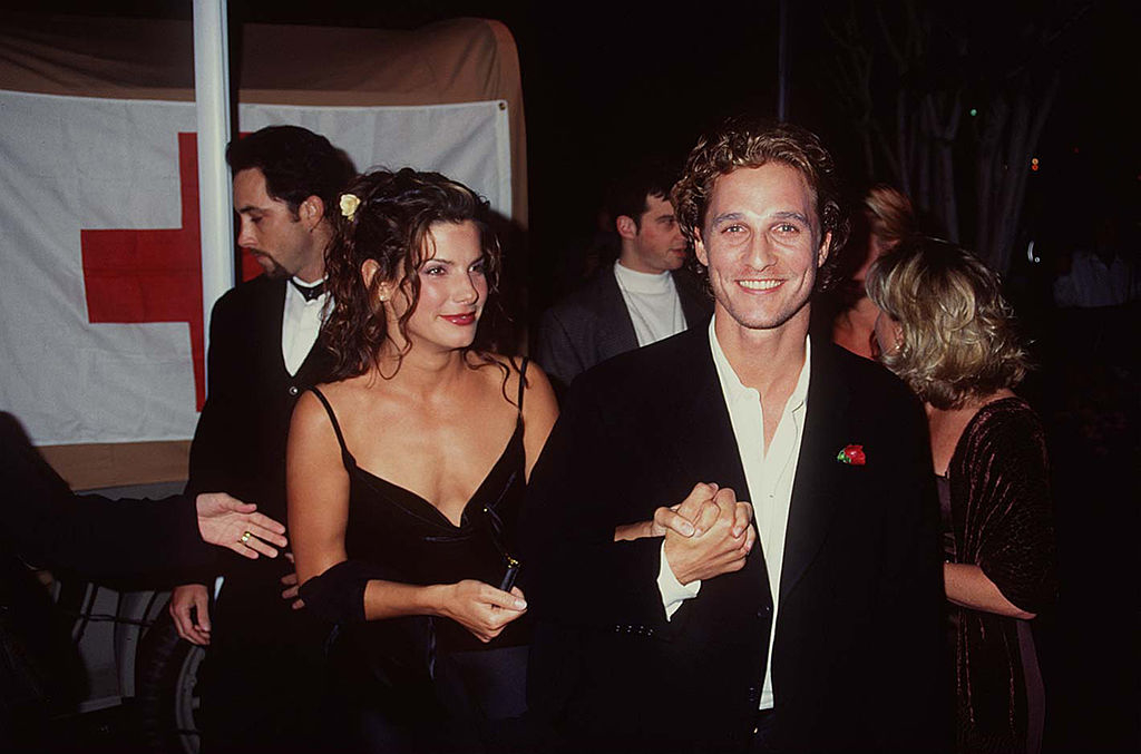 sandra and matthew holding hands at an event