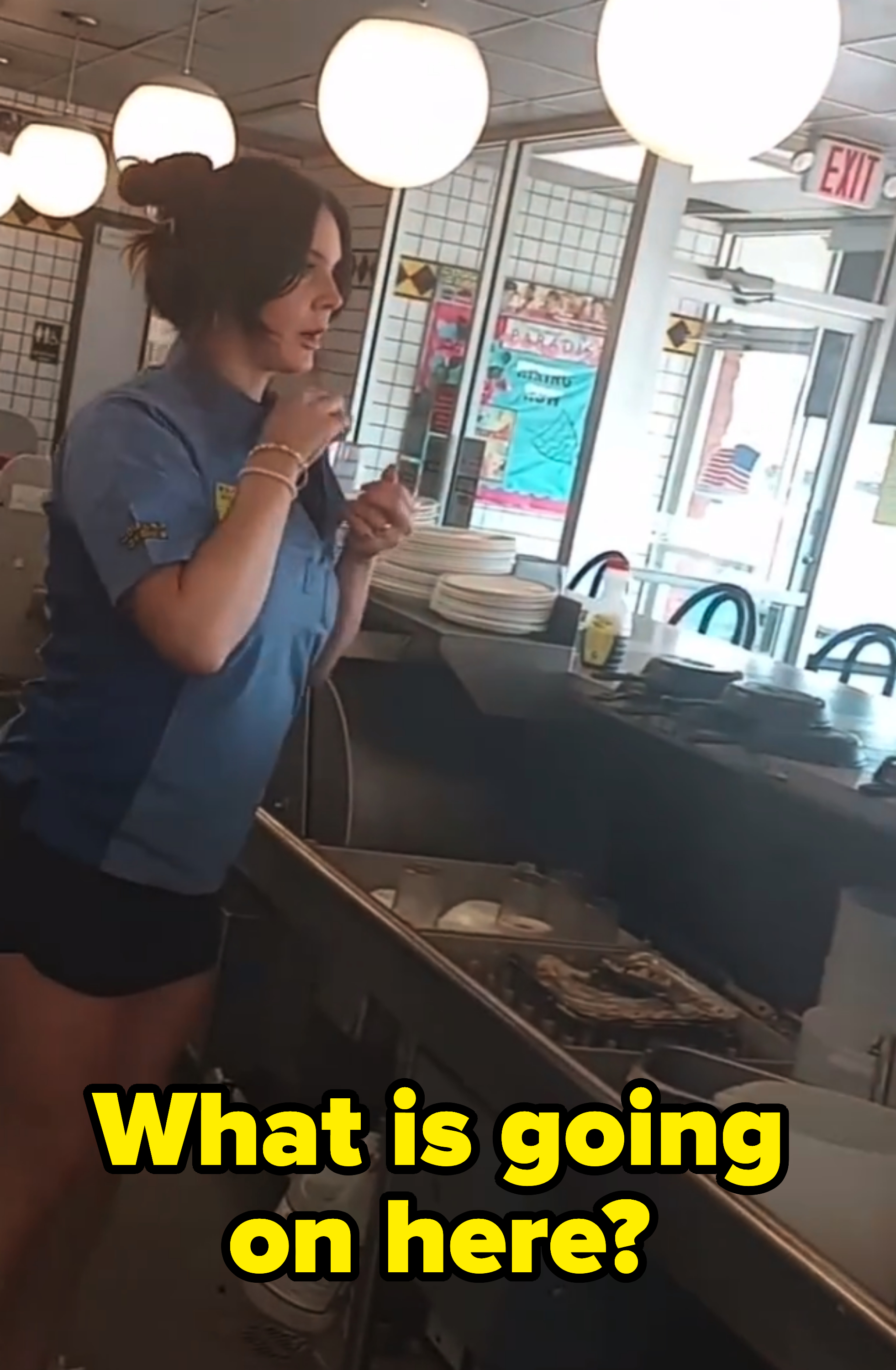 lana behind the counter with text reading what is going on here