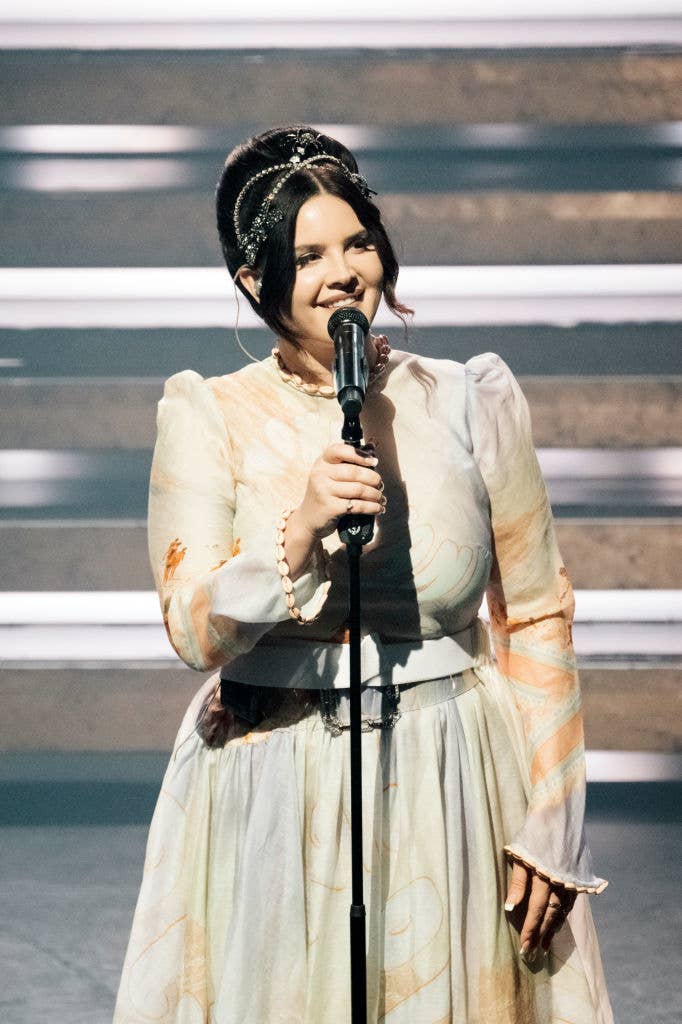 lana on stage with a mic