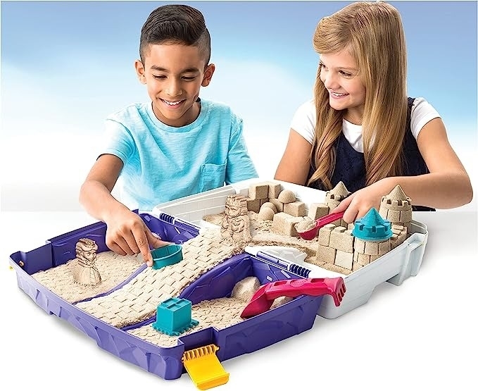Kids play with kinetic sand