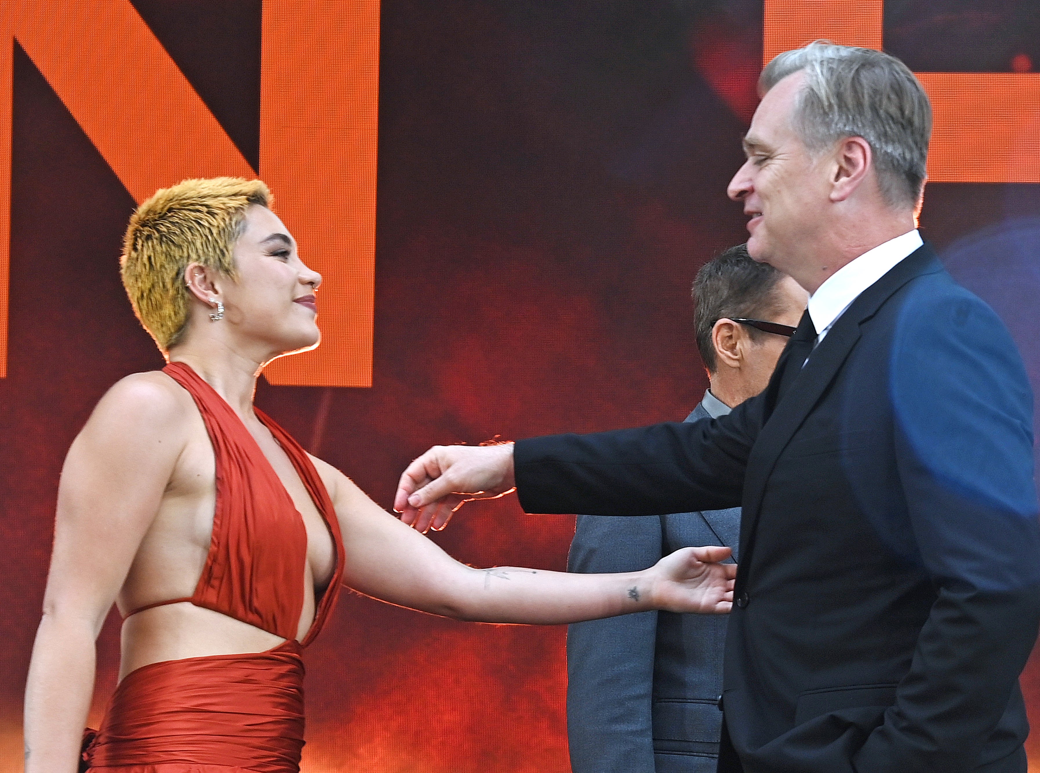 Florence and Christopher about to hug on the red carpet