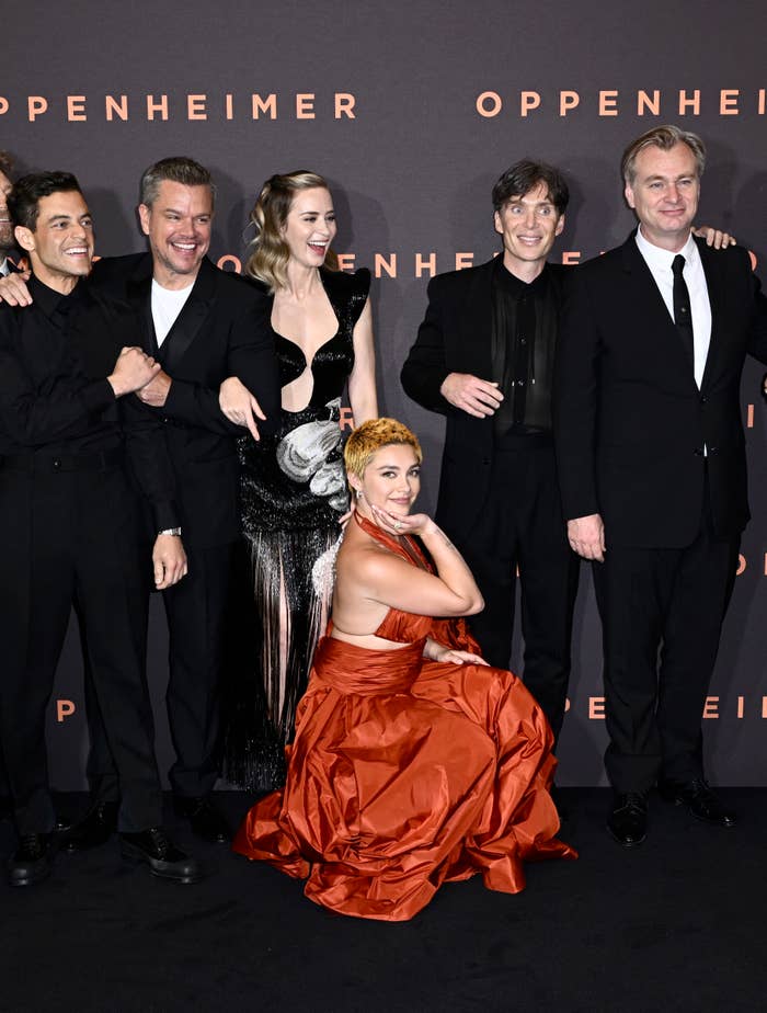 The cast of Oppenheimer poses at its premiere before leaving