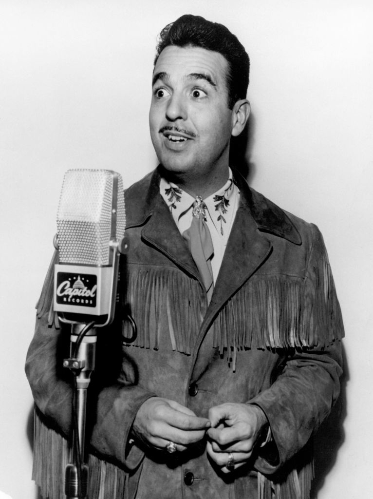 Tennessee Ernie Ford at a microphone