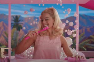 Margot Robbie brushing her teeth as Barbie