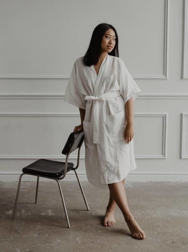 model in white linen bathrobe