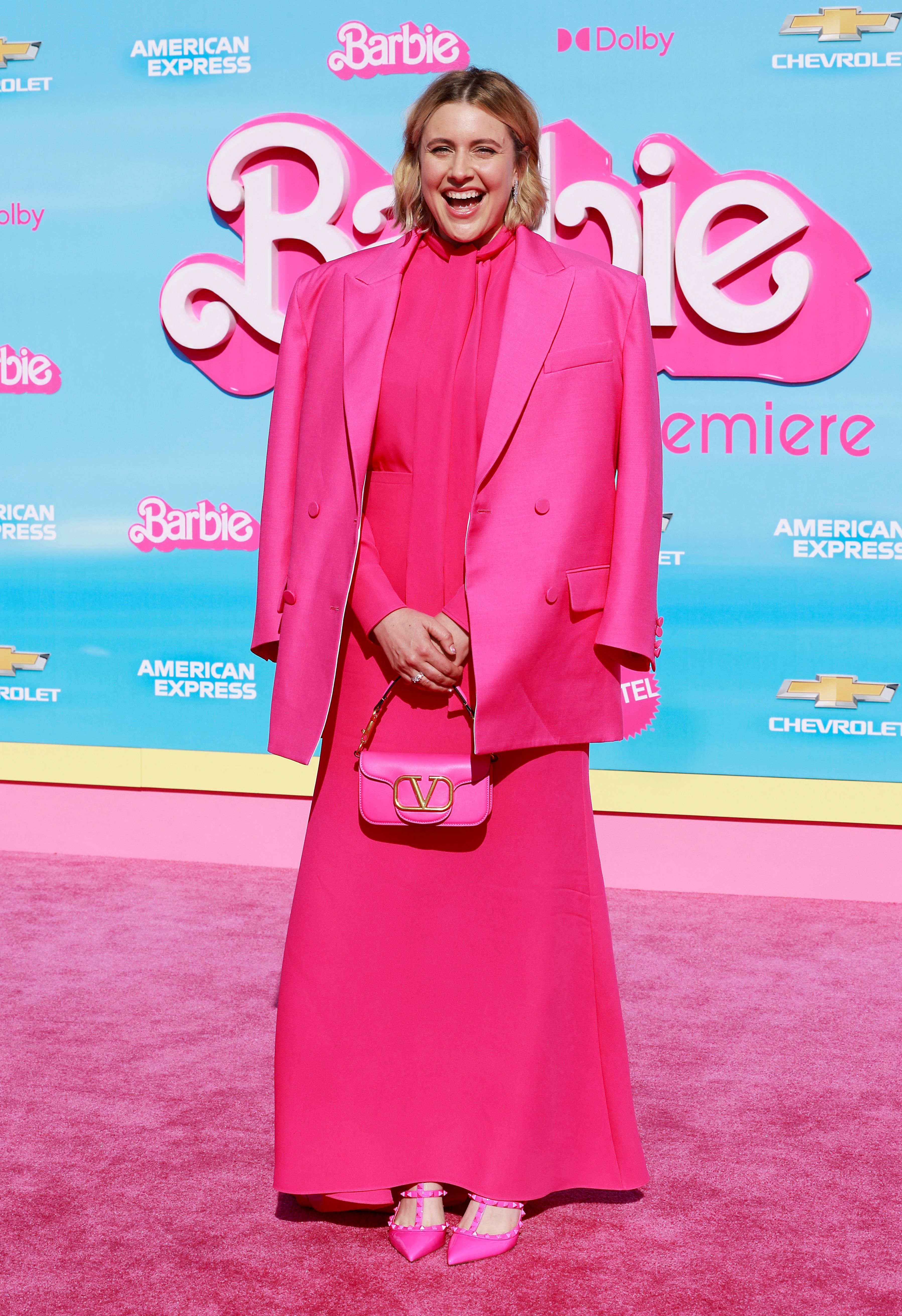 Closeup of Greta Gerwig on the pink carpet at a premiere for Barbie