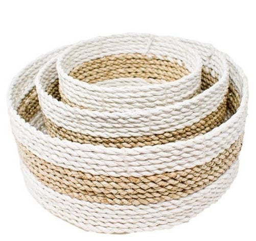 three nesting natural and white round woven baskets
