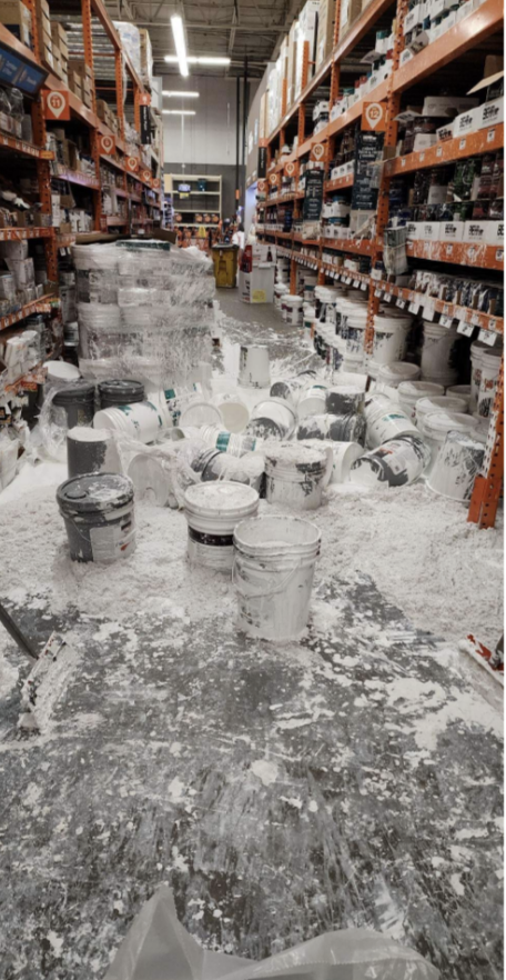 gallons of paint spilled in an aisle