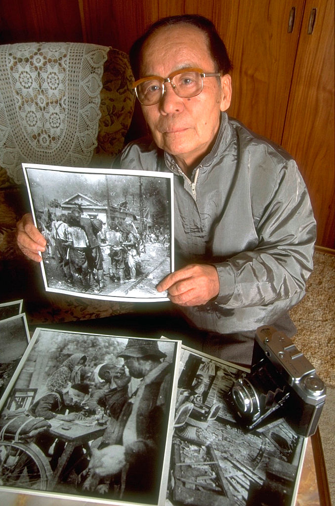 Yoshito Matsushige with his photos