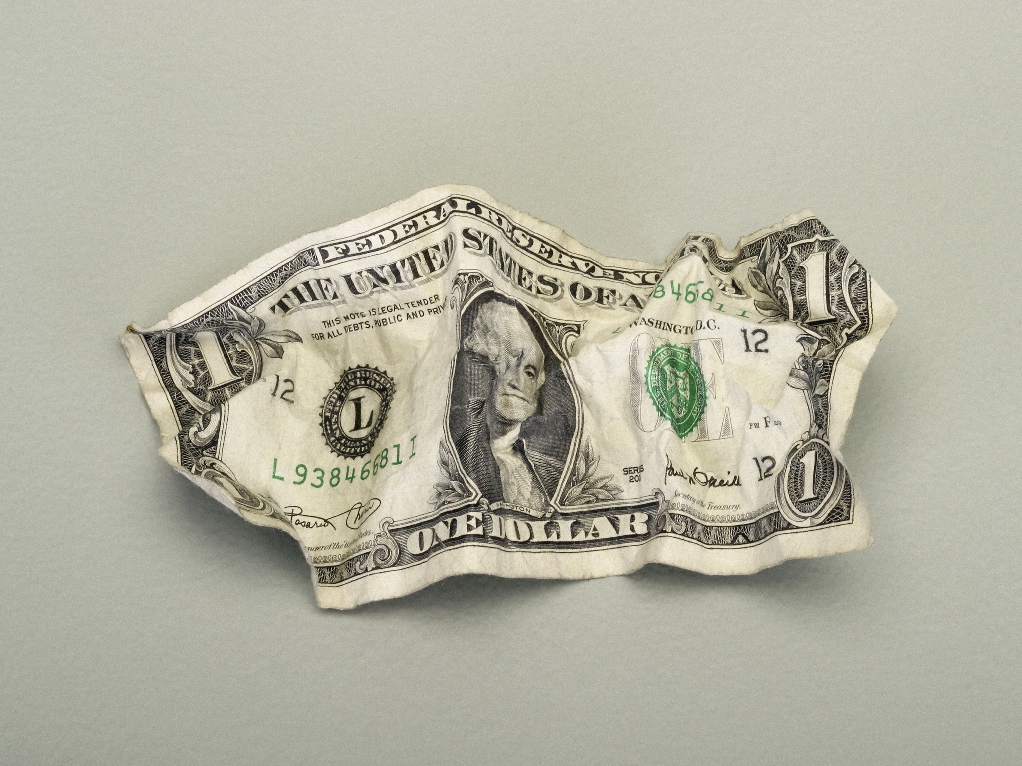crumpled up dollar bill