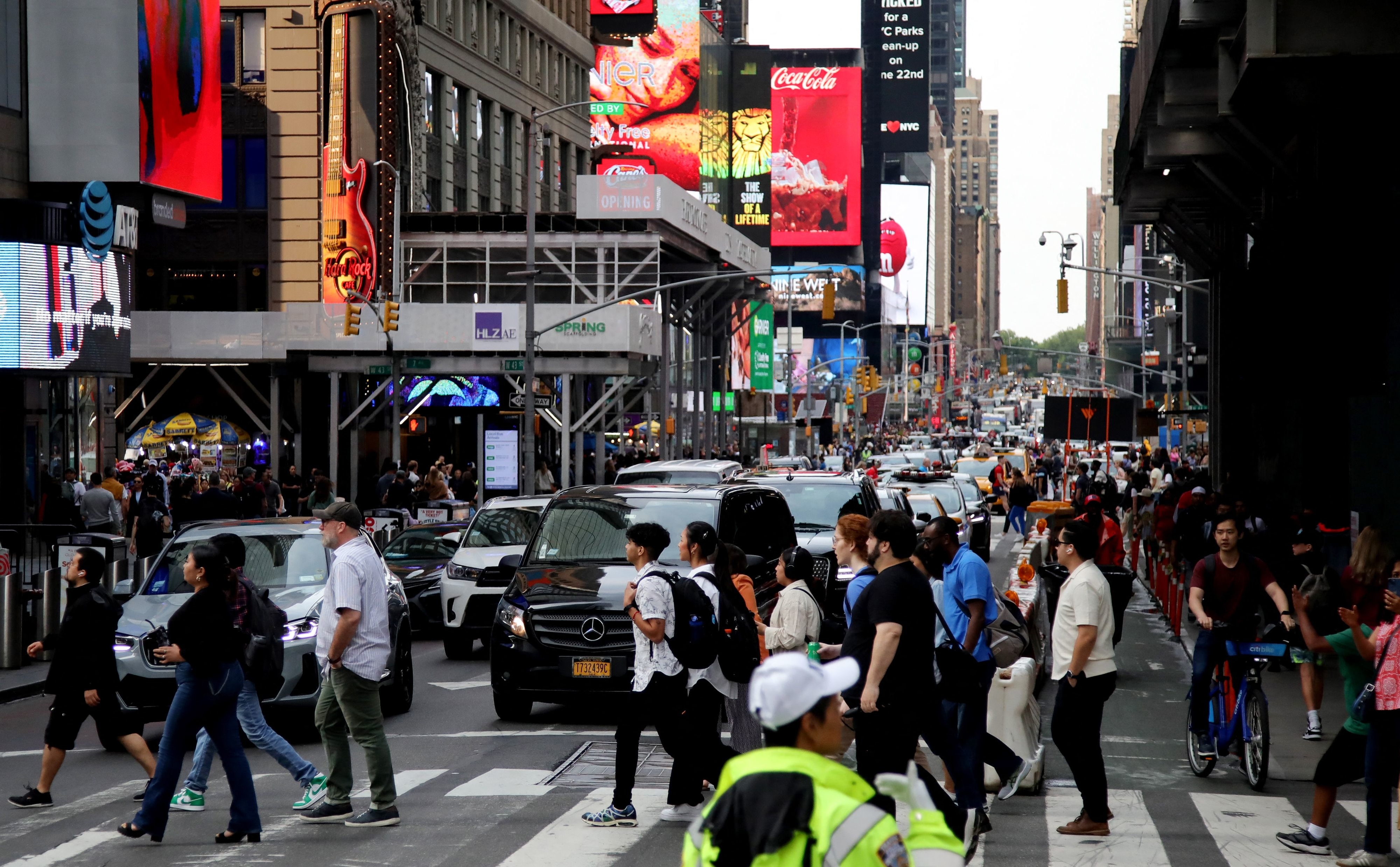 people crossing a busy street