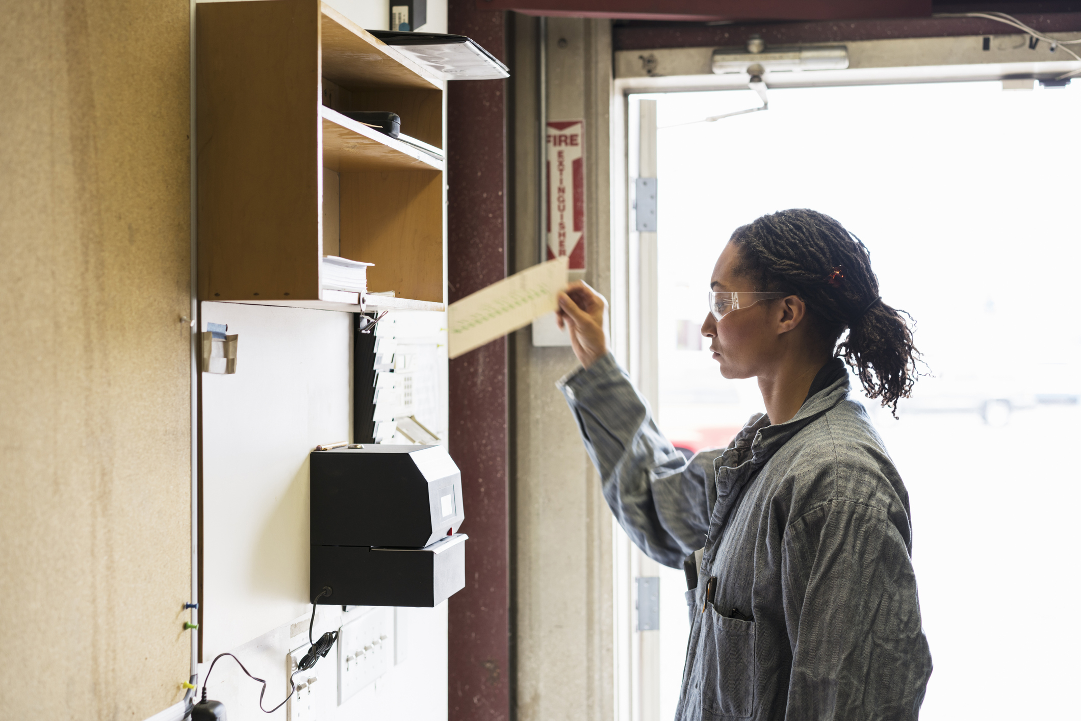 A woman clocking in