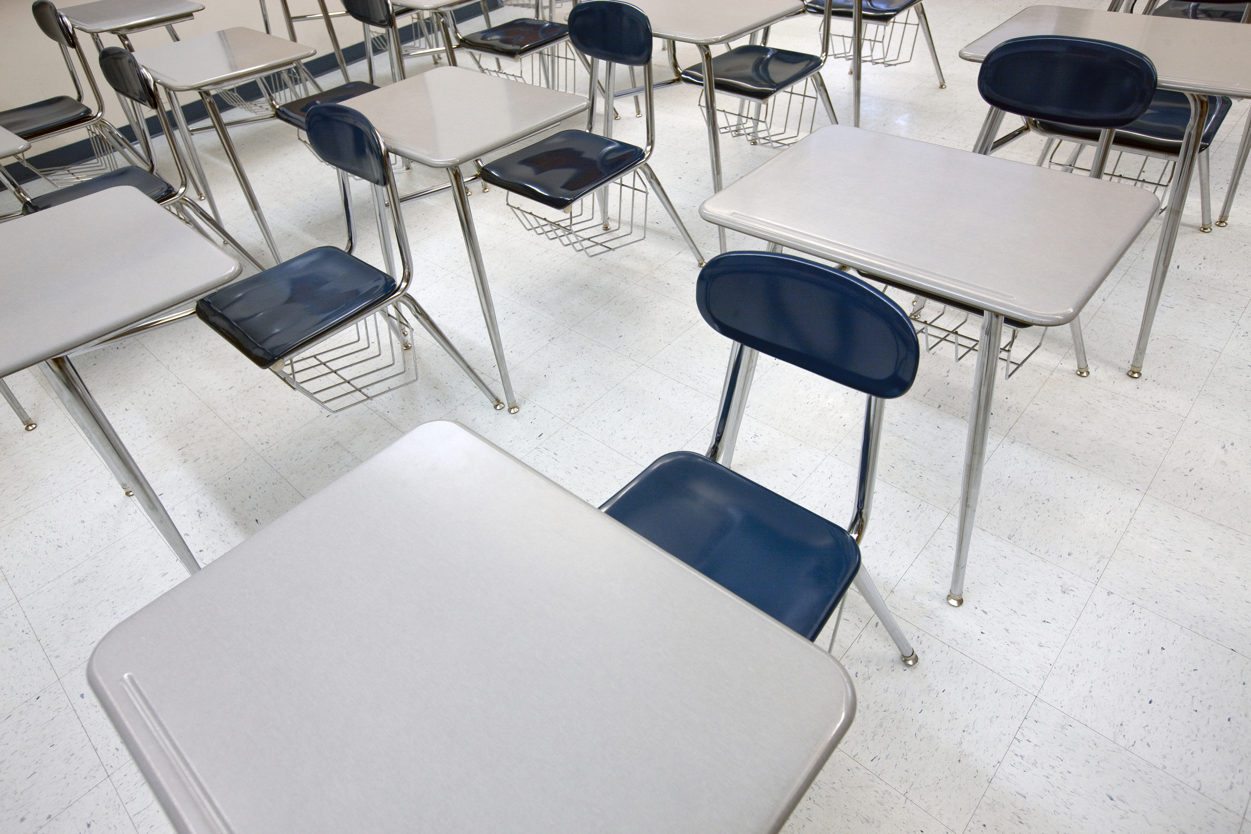 Empty chairs and desks in a classroom