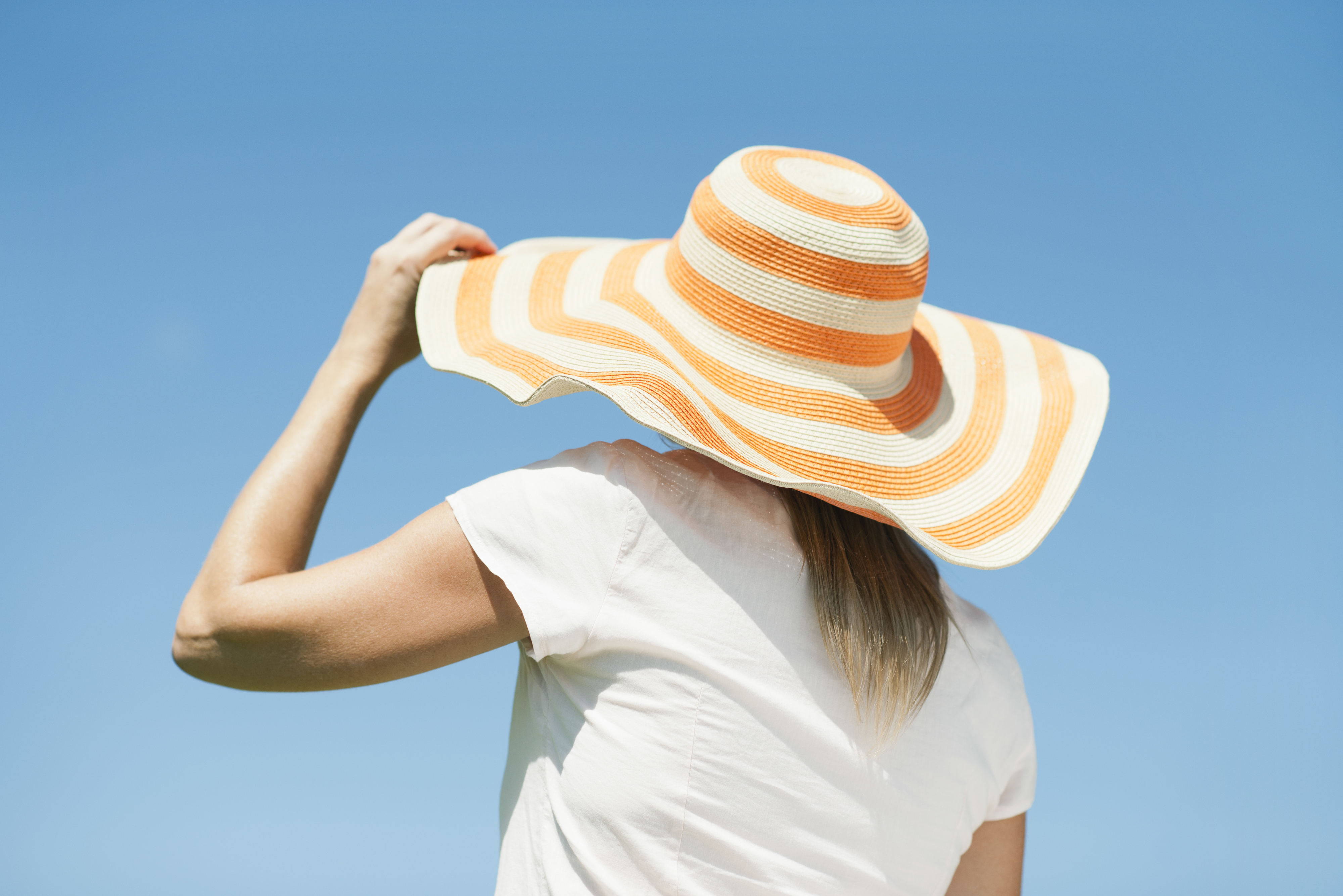 woman wearing a sun hat