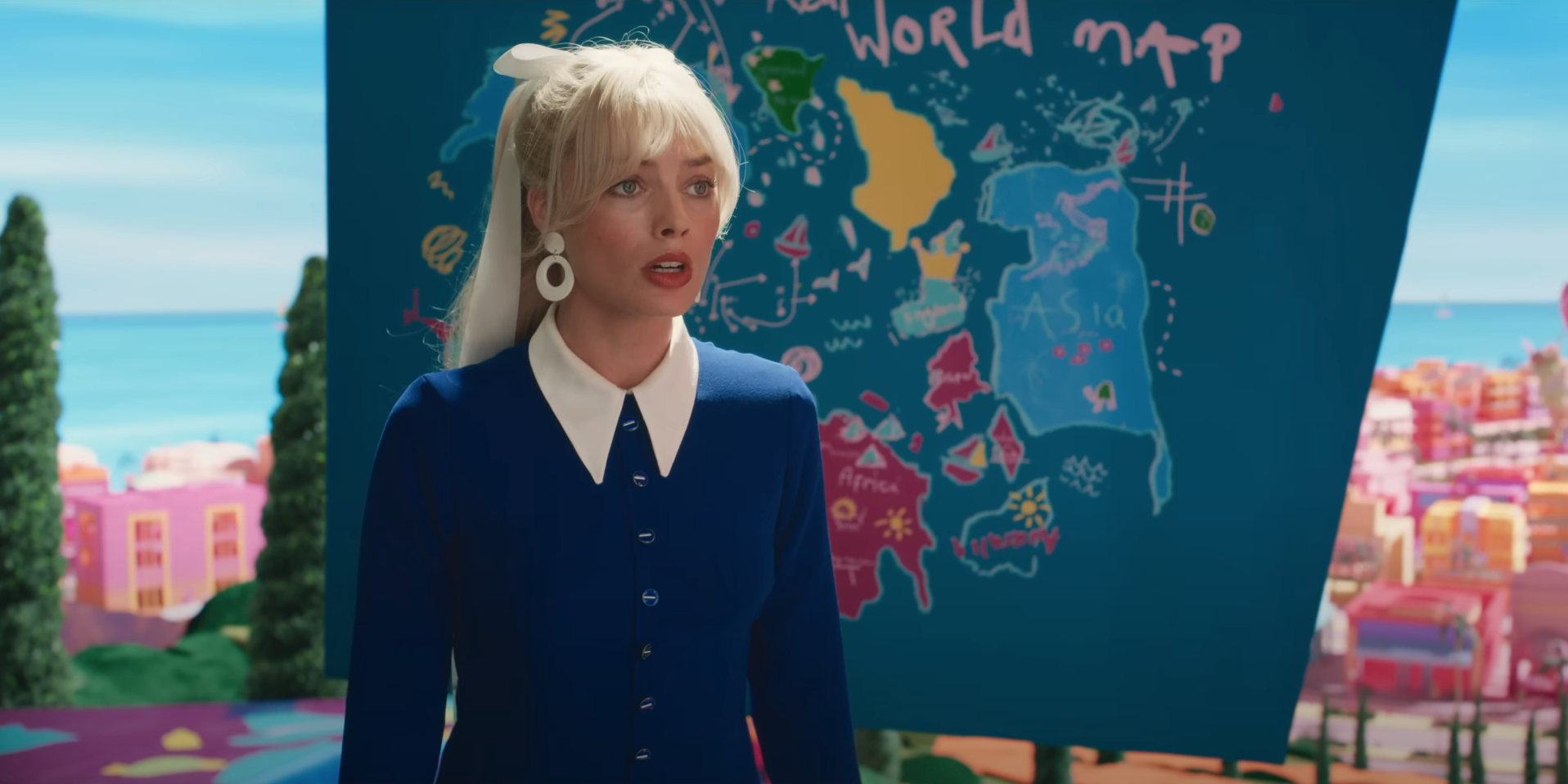 Barbie with the world map behind her