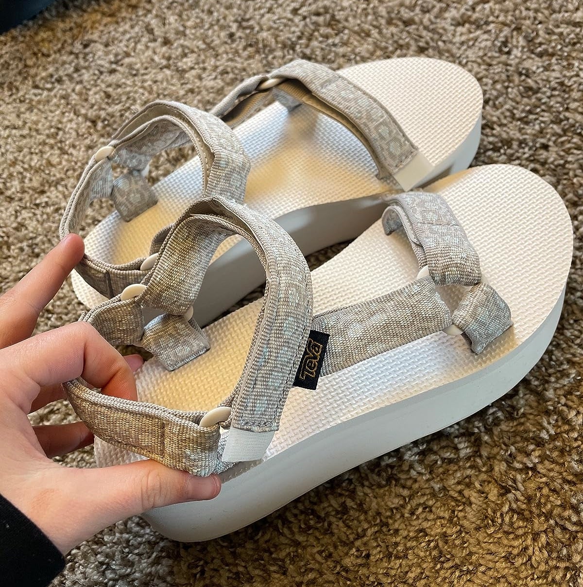 Image of reviewer holding sandals