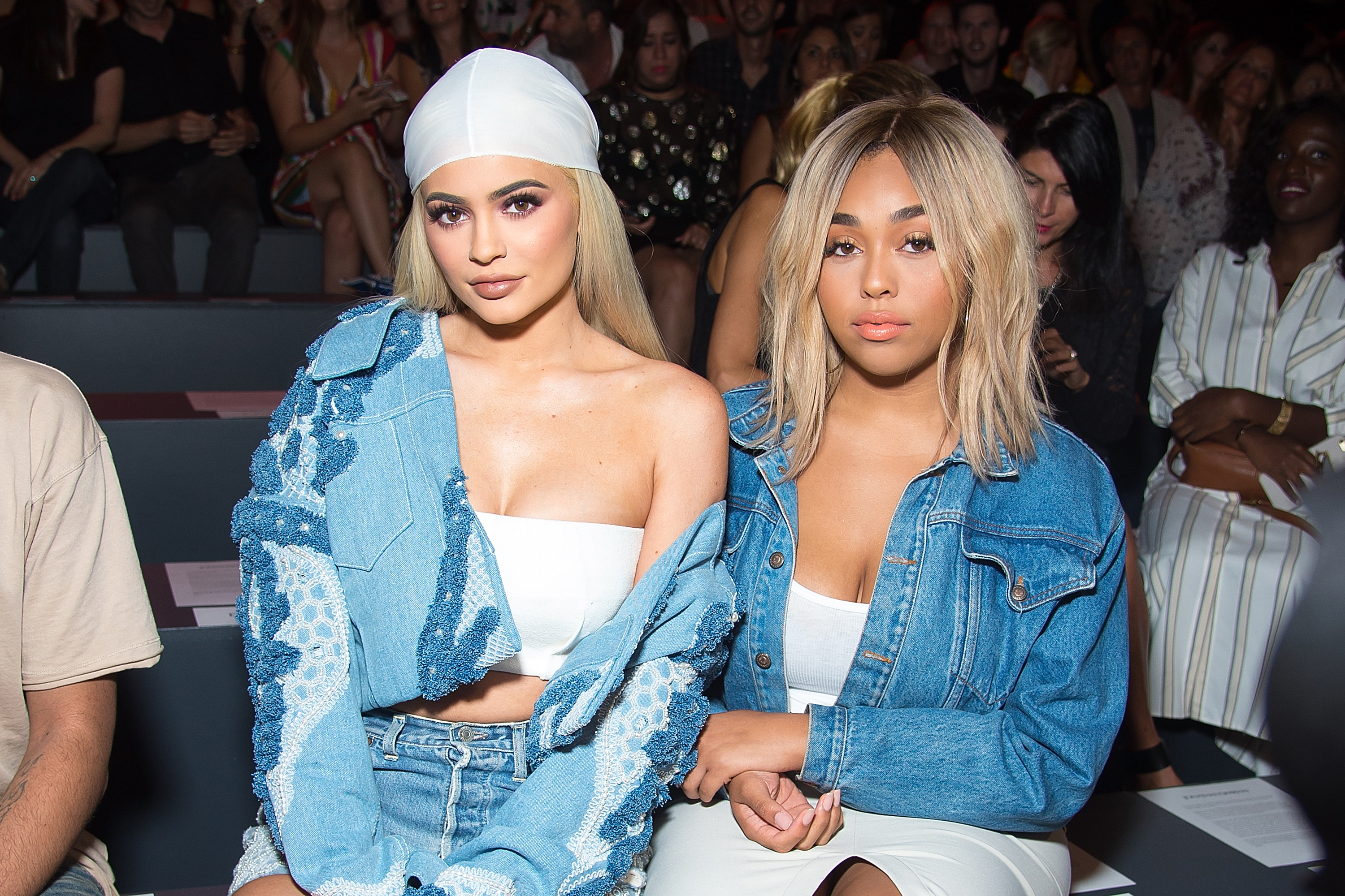 jordyn and kyllie sitting at a fashion show