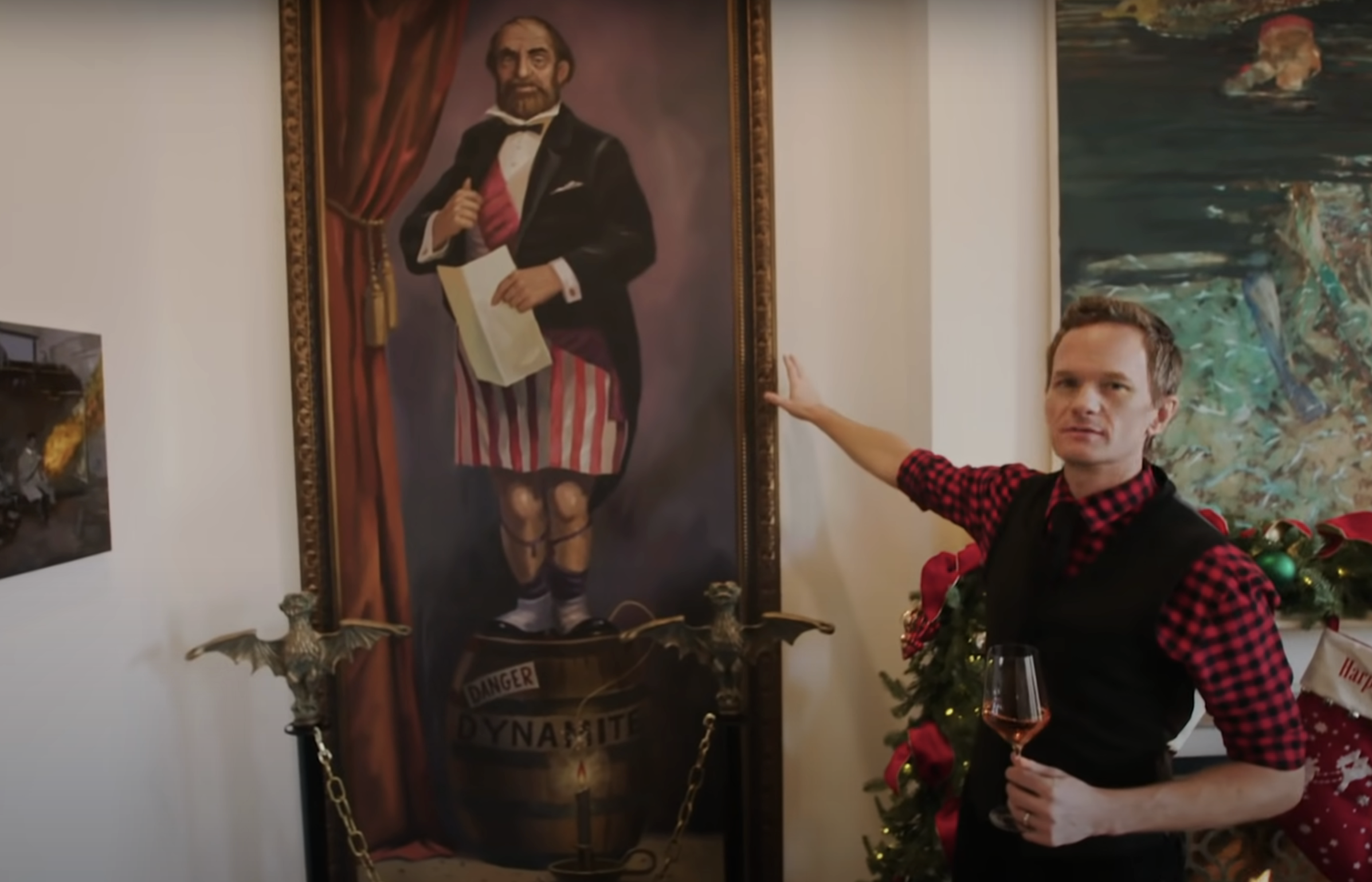 Neil Patrick Harris in his home with a painting from the Haunted Mansion ride at Disney World