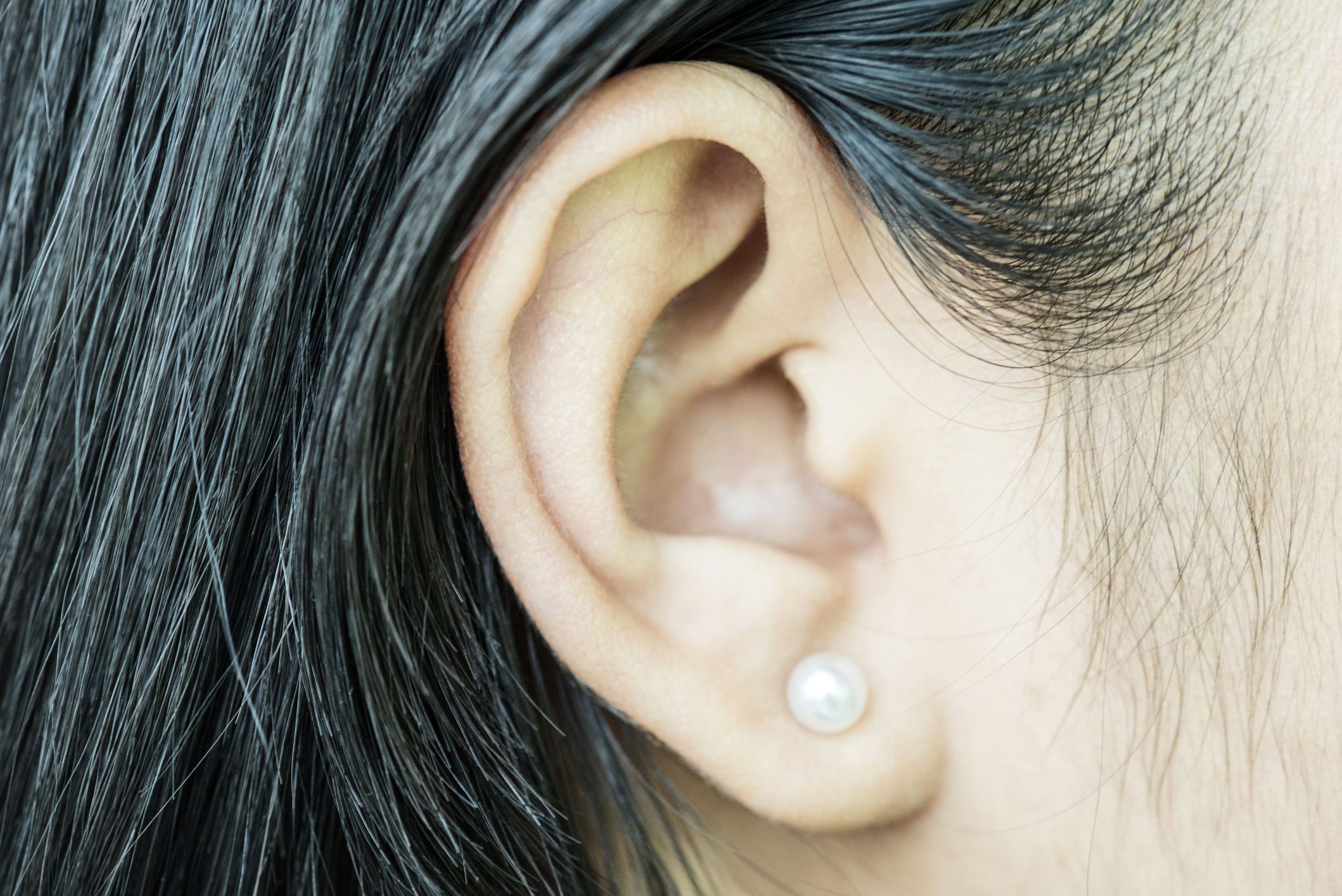 An ear with a pearl earring